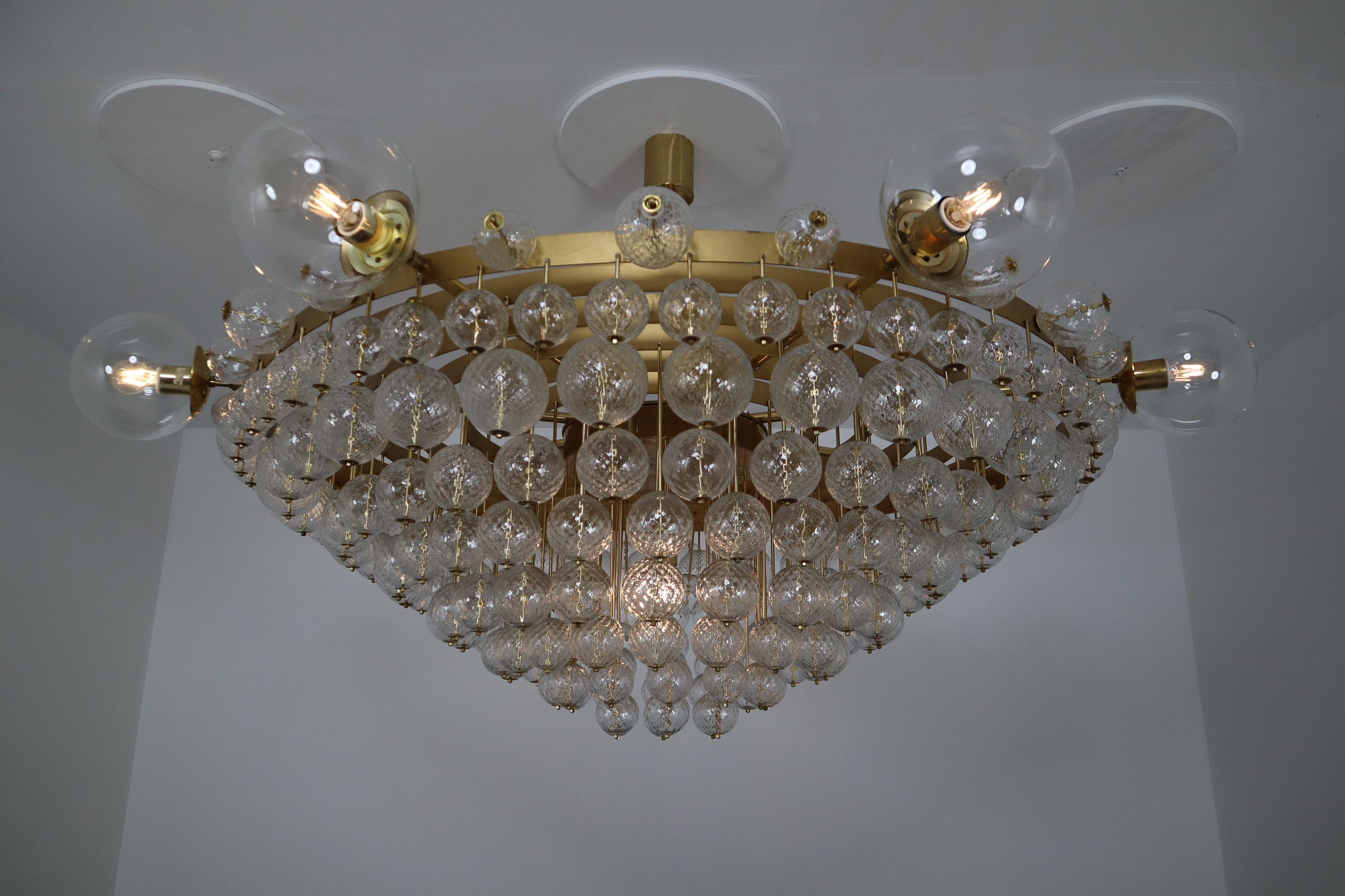 Extremely Large Hotel Chandelier with Brass Fixture and Structured Glass Globes In Good Condition In Almelo, NL