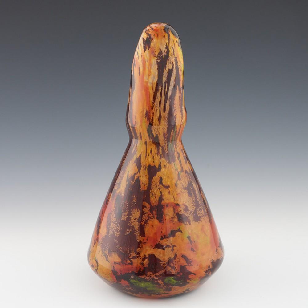 Heading : Extremely large Scneider pitcher
Date : c1921-1926
Origin : Epinay-sur-Seine, France
Decoration : Mottled burtn orange, plumb and citrine glass, fire polished with applied black handle
Glass Type : Lead.
Size :    36.2cm height, 18.8cm