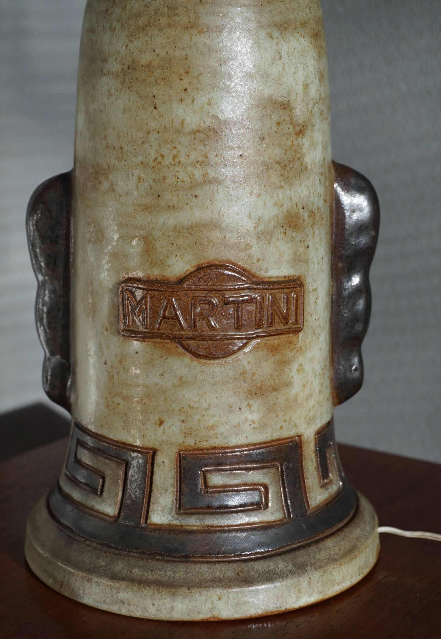 Museum quality and condition, vintage Martini table lamp.

When we first laid eyes on this Italian and all handcrafted table lamp we immediately felt it was very special. After doing a little research we found that this vintage Martini table lamp is