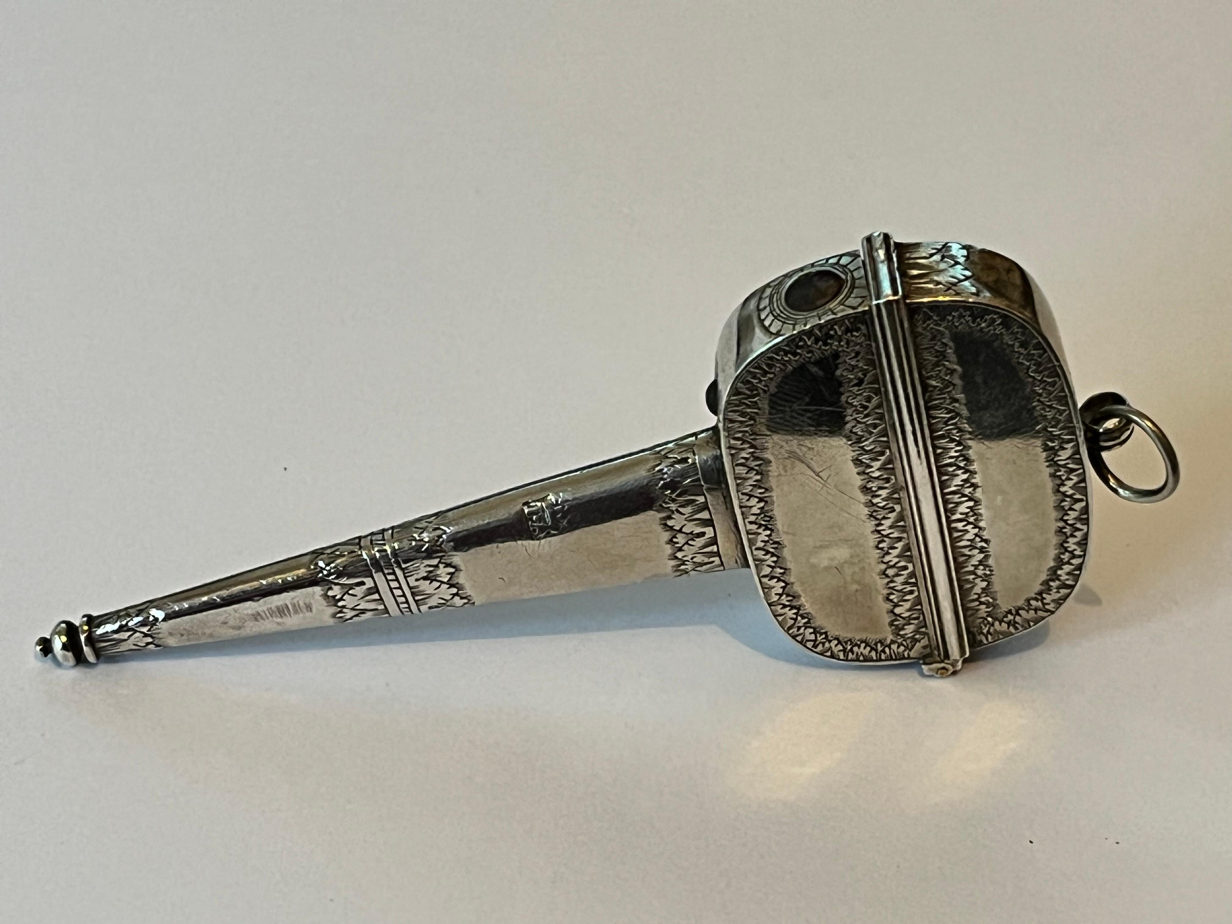 An extremely rare Charles II silver scissors case, the body scratch-engraved with scrolling acanthus foliage, the stem with acanthus diaper motifs and spherical finial to the base. The three-lugged hinge with push-button snap fastener and suspensory