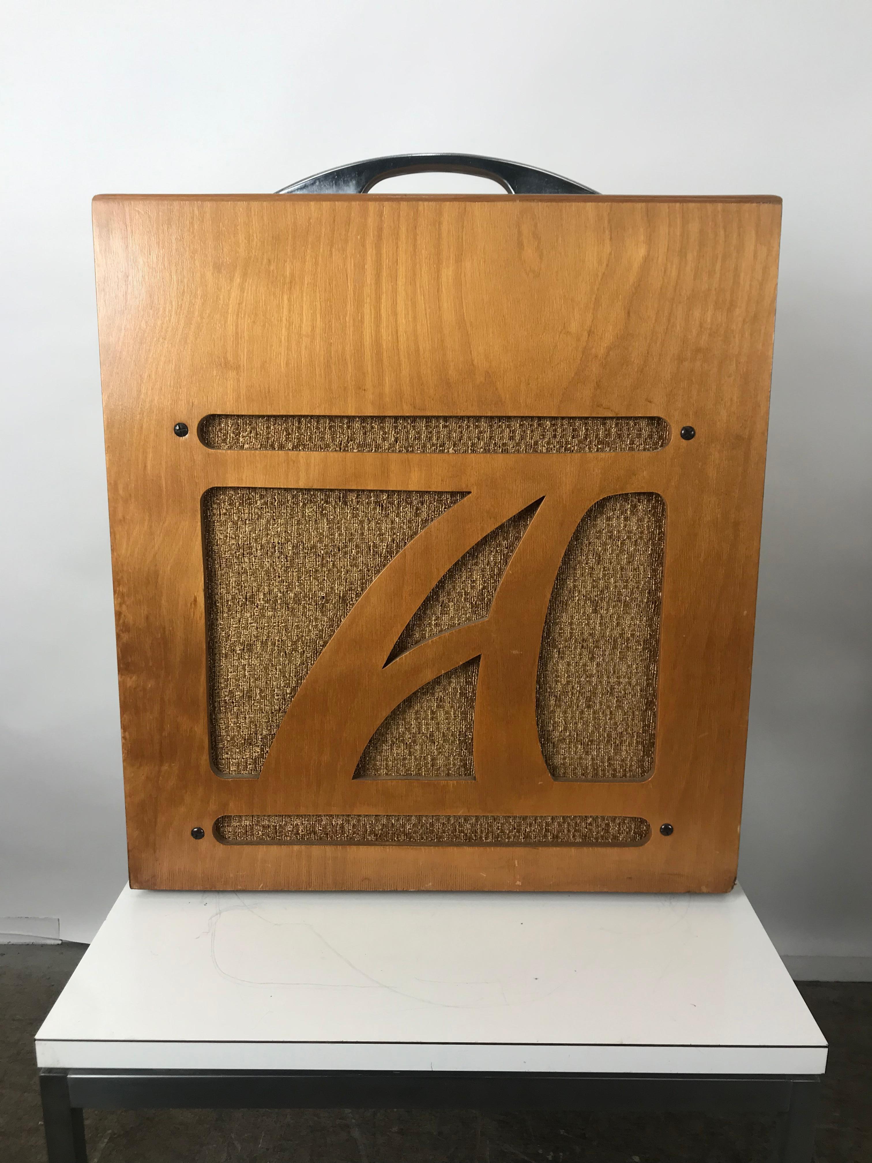 Extremely rare 1954 Alamo Electrical musical amplifier, model 6A, mint original showroom condition, retains original canvas cover, complete with operating instructions and warranty bond,

Alamo Model 6A from the 1950s. It had the original cloth