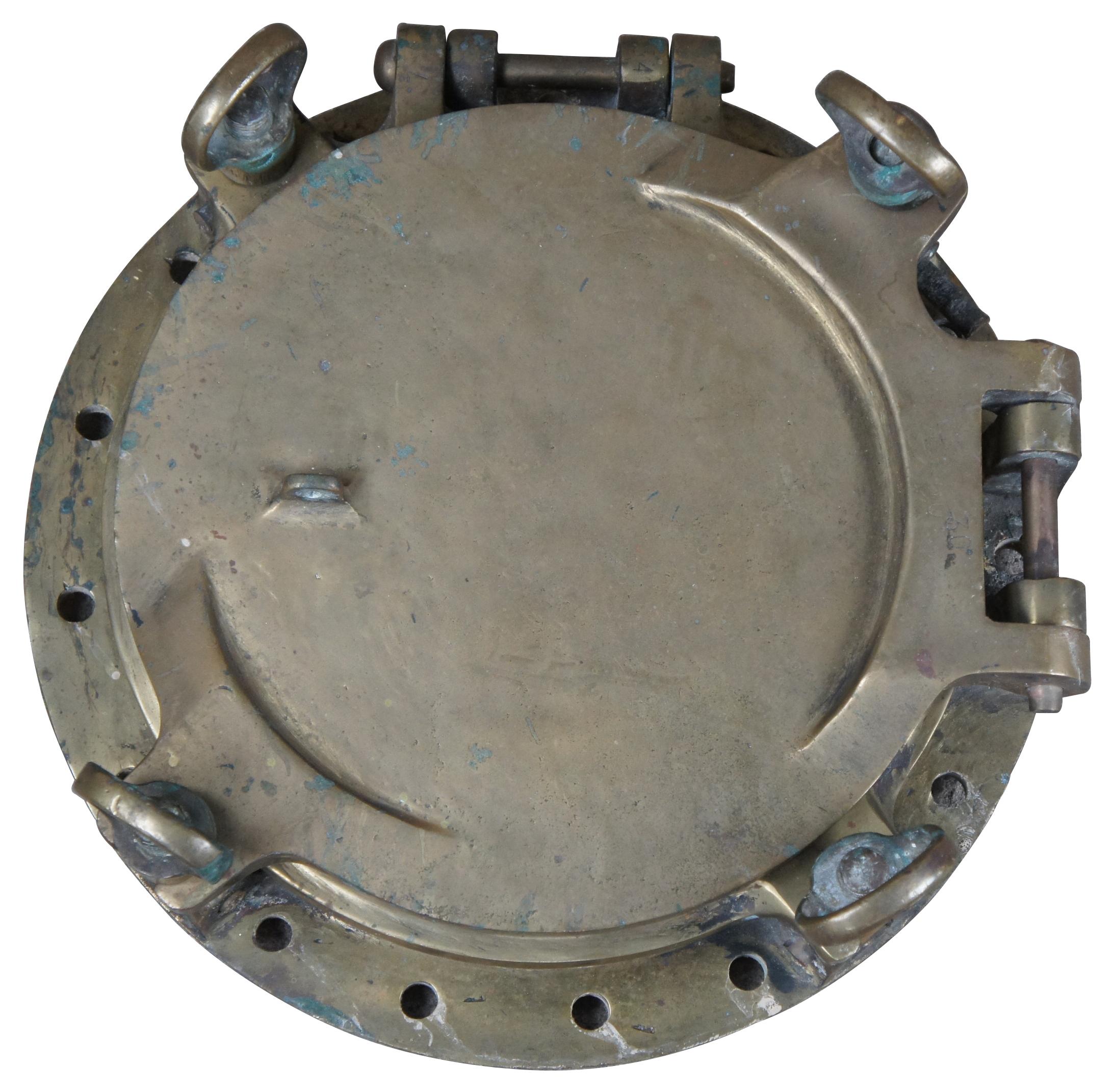 Extremely unique original antique heavy solid brass maritime Ship's Porthole or Hatch. A rare find with storm door, swing plate and barking plate. Its very unusual to find a complete porthole with swing plate. They are most often found as just a