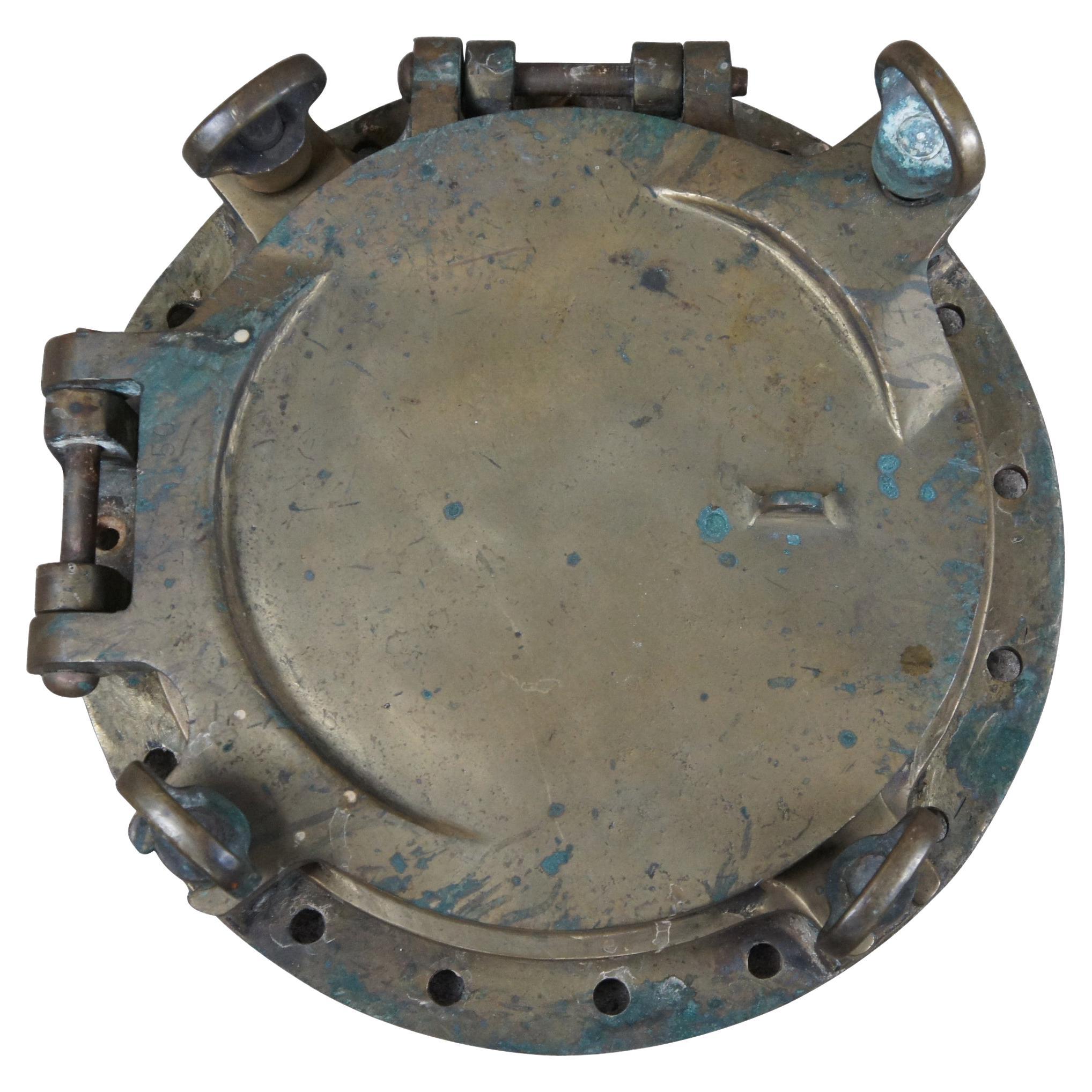 Extremely unique original antique heavy solid brass maritime Ship's Porthole or Hatch. A rare find with storm door, swing plate and barking plate. Its very unusual to find a complete porthole with swing plate. They are most often found as just a