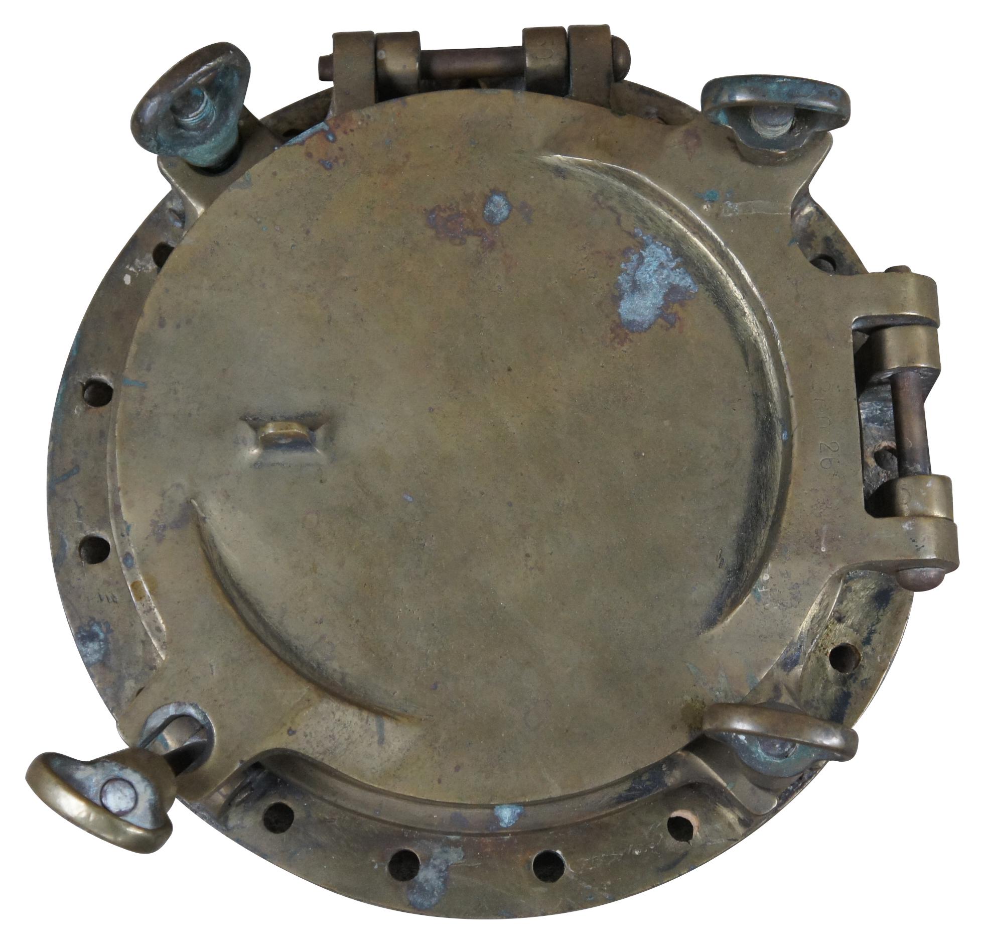 Extremely unique original antique heavy solid brass maritime Ship's Porthole or Hatch. A rare find with storm door, swing plate and barking plate. Its very unusual to find a complete porthole with swing plate. They are most often found as just a