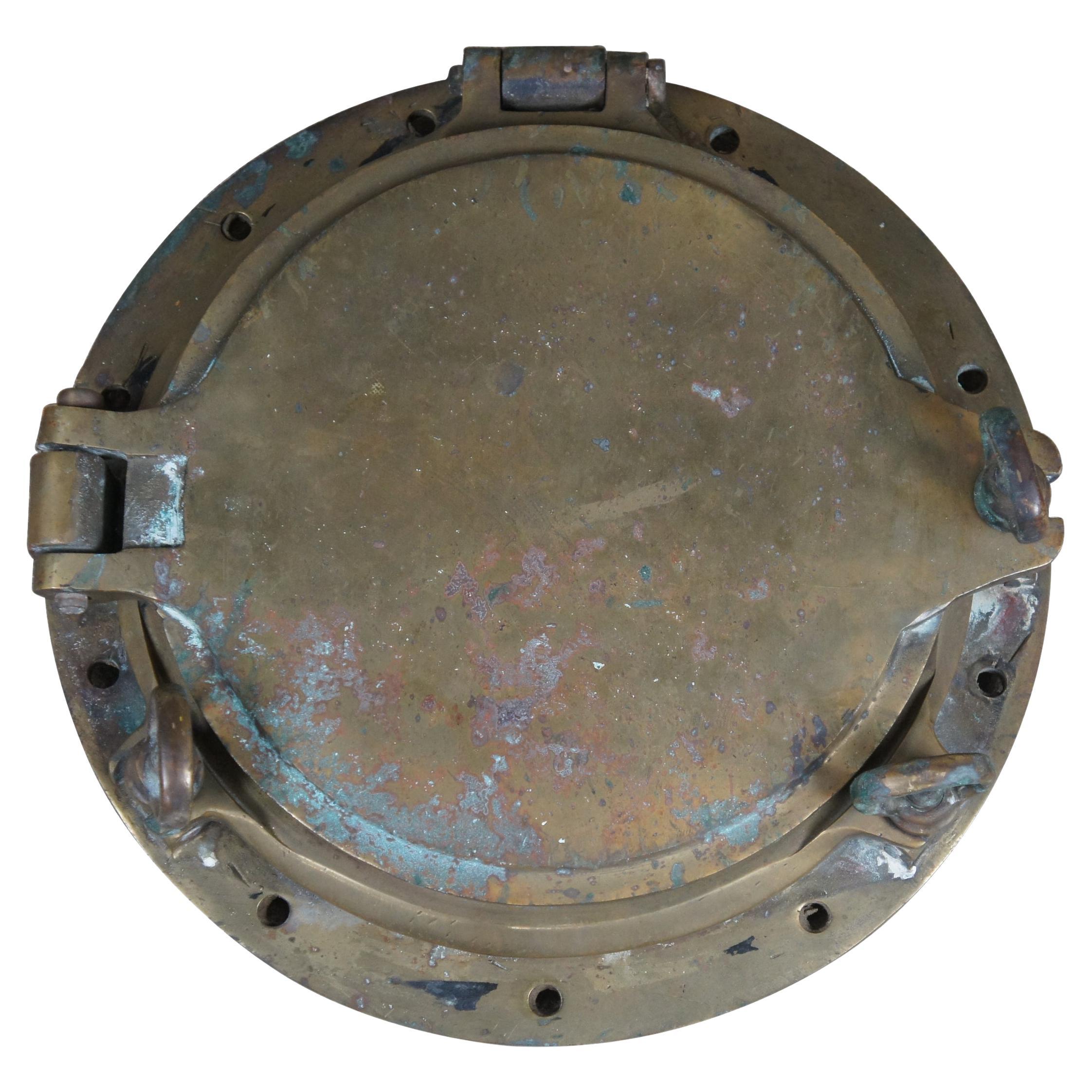 Extremely unique original antique heavy solid brass maritime Ship's Porthole or Hatch. A rare find with storm door, swing plate and barking plate. Its very unusual to find a complete porthole with swing plate. They are most often found as just a