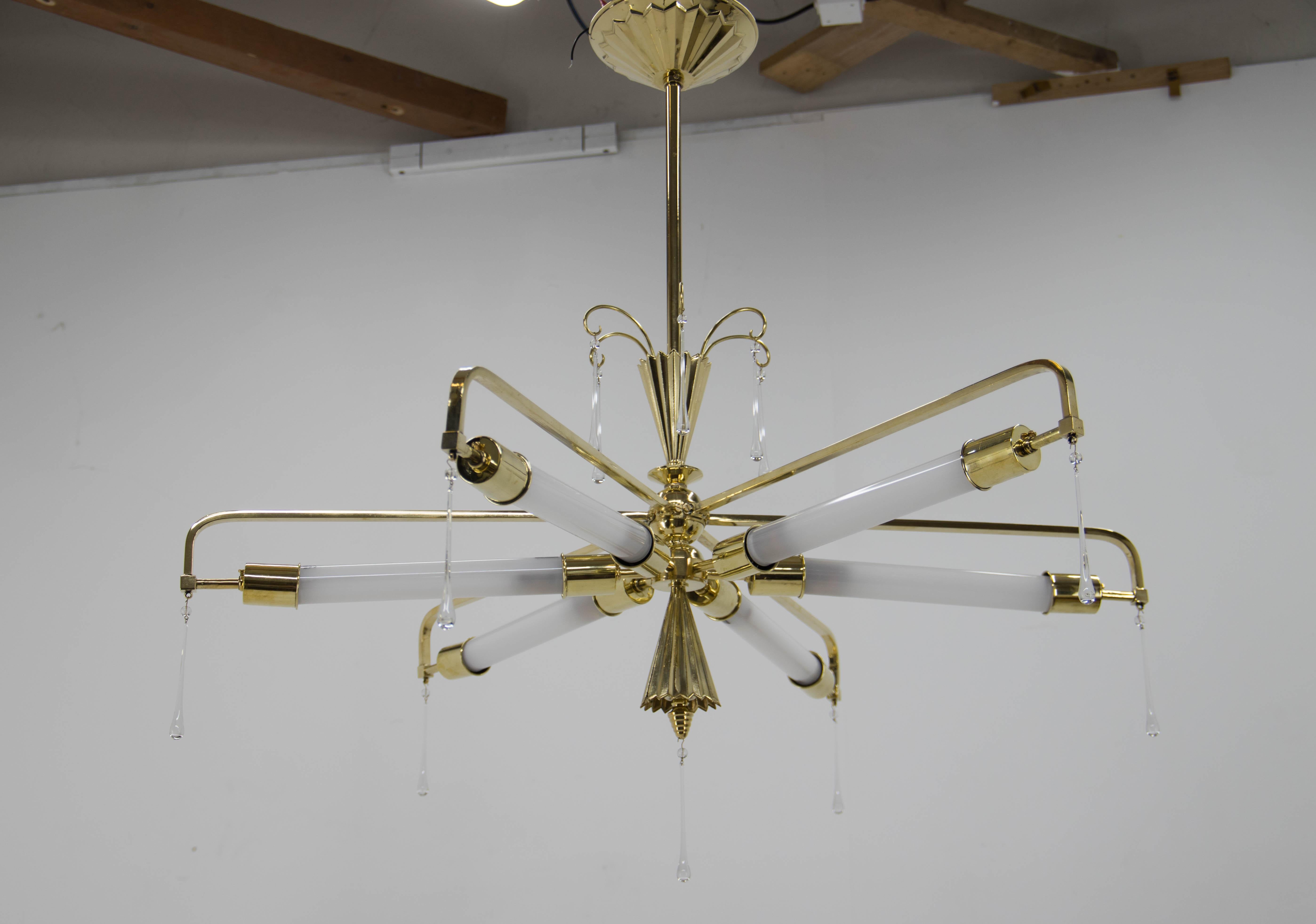 Absolutely astonishing Art Nouveau/Art Deco chandelier attributed to Wiener Werkstatte. 
Professionally restored: brass construction was refinished and polished. Due to the presence of a hooks on the chandelier, we assume that there were glass beads