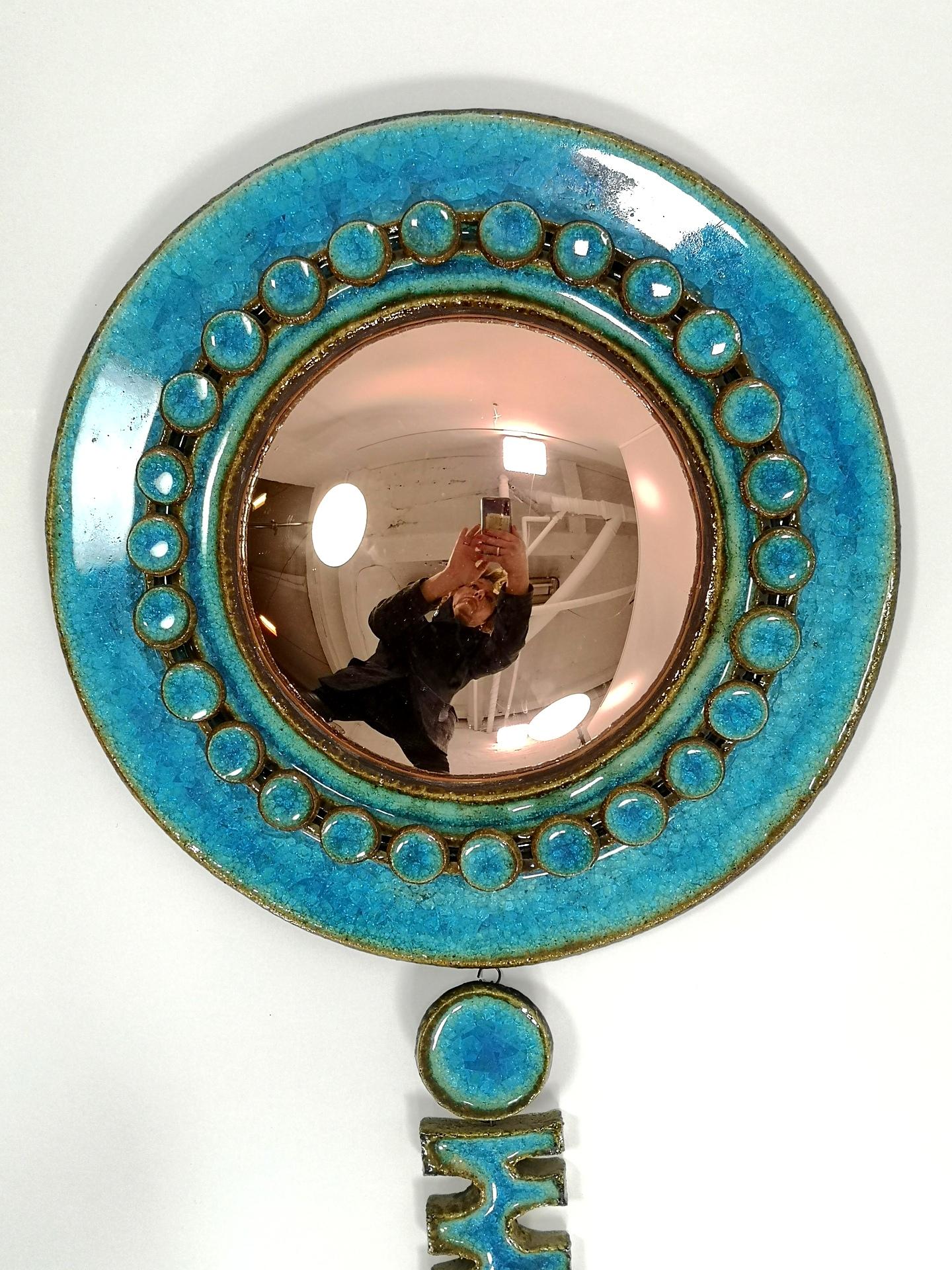 This vintage designer piece, signed by renowned Hungarian ceramist Gyula Vegvari is must-have for any serious collector with an appreciation for Eastern European mid-century ceramic art. The unusual shape and large size of this wall mirror dominates