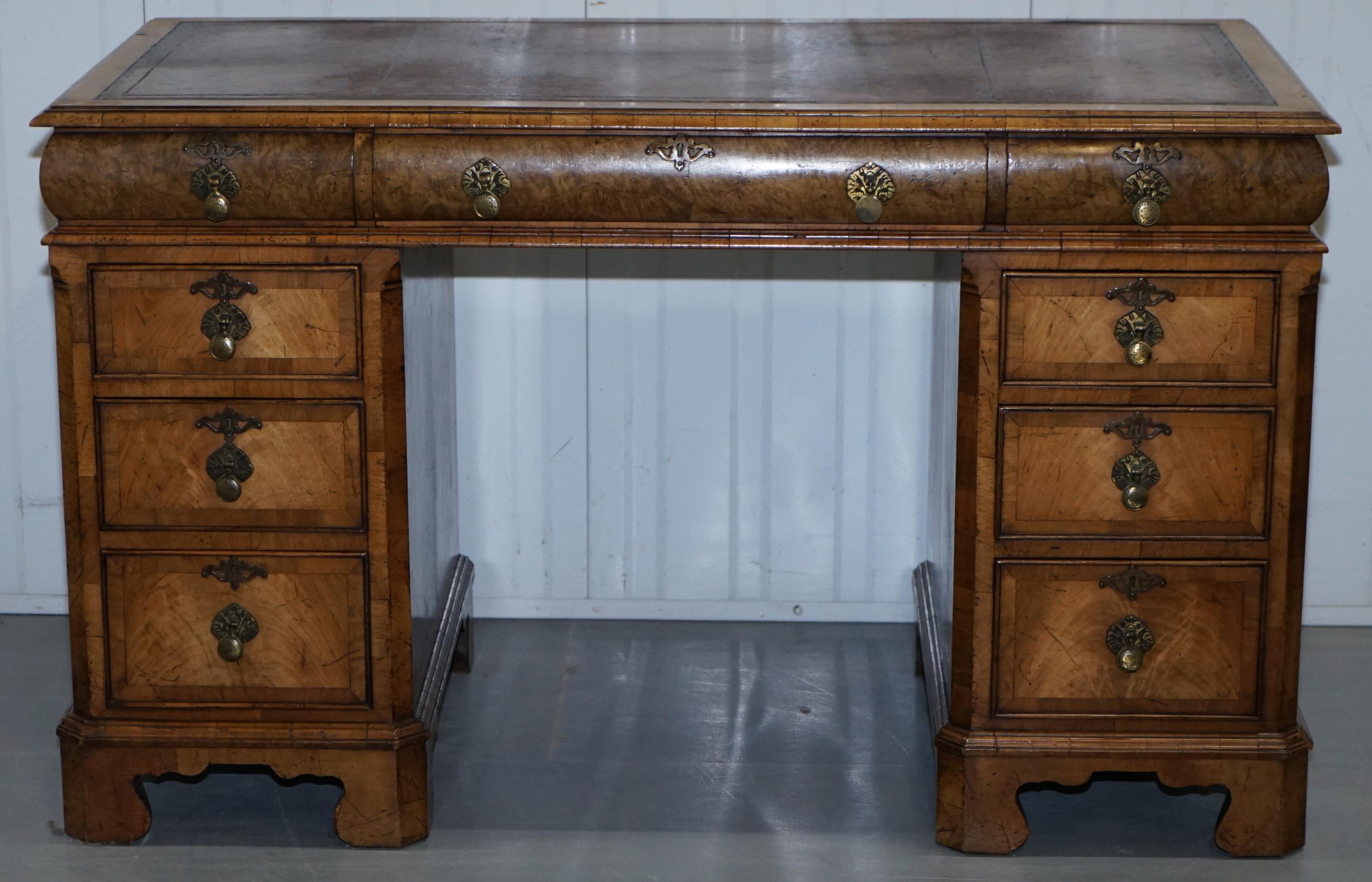 We are delighted to offer for sale this extremely rare regency circa 1815 solid burr walnut curved twin pedestal desk with cushion topped drawers.

This desk is a tour de force of style class and design, its beautifully curved on all sides, the