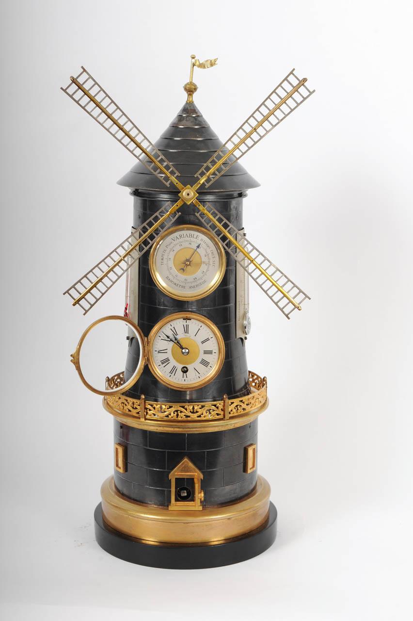 An extremely rare French 'pendule industrial' wind mill with automaton, barometer and two thermometers, circa 1880
Description
Case: brass, partly gilt, partly blued, black marble base, masoned wind mill, rotating wind mill vanes, hinged clock case,