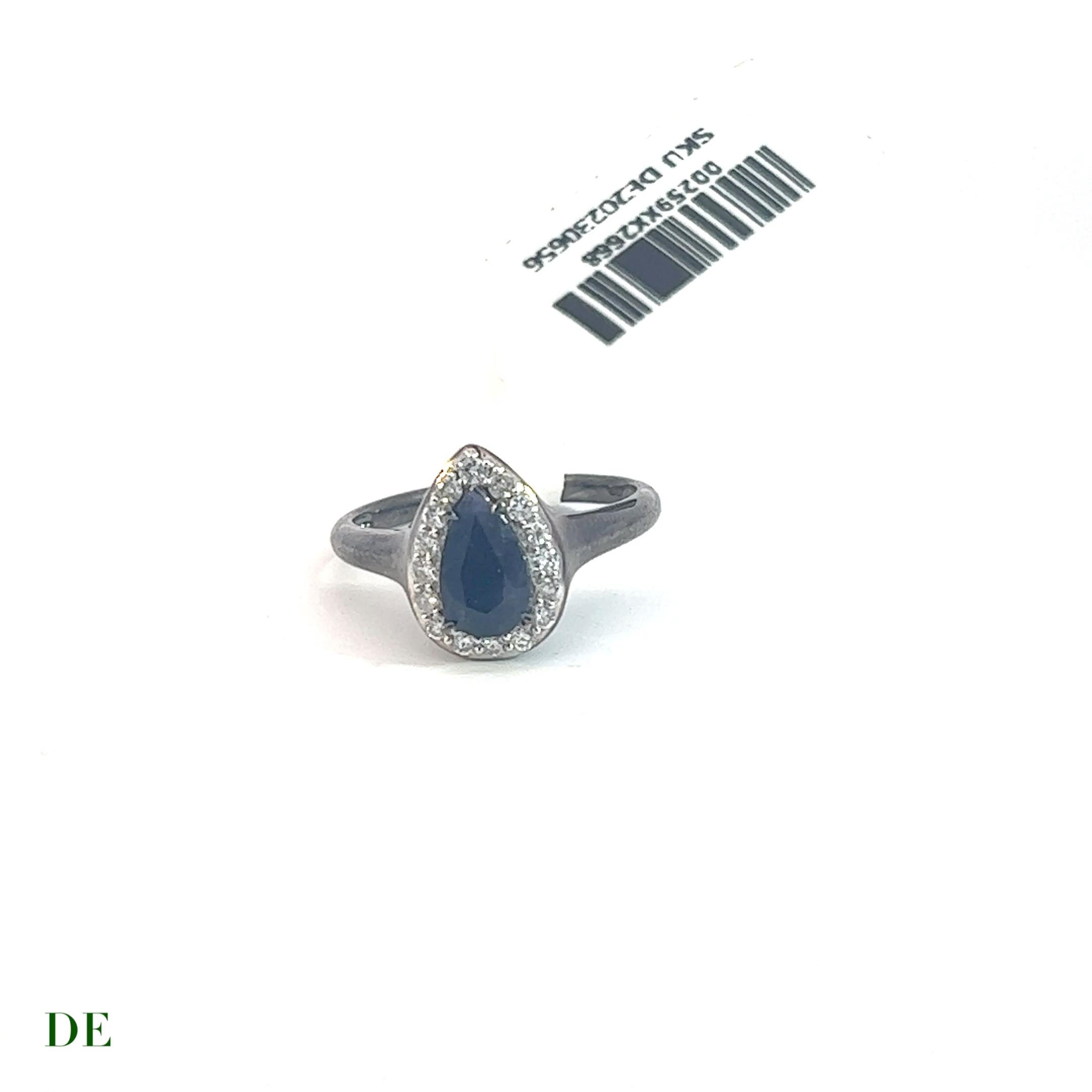 This extremely rare Kashmir sapphire and diamond ring is a true masterpiece that exudes luxury and opulence. The centerpiece of the ring is an exquisite Kashmir sapphire gemstone that weighs approximately 1.2 carats and boasts a stunning deep blue