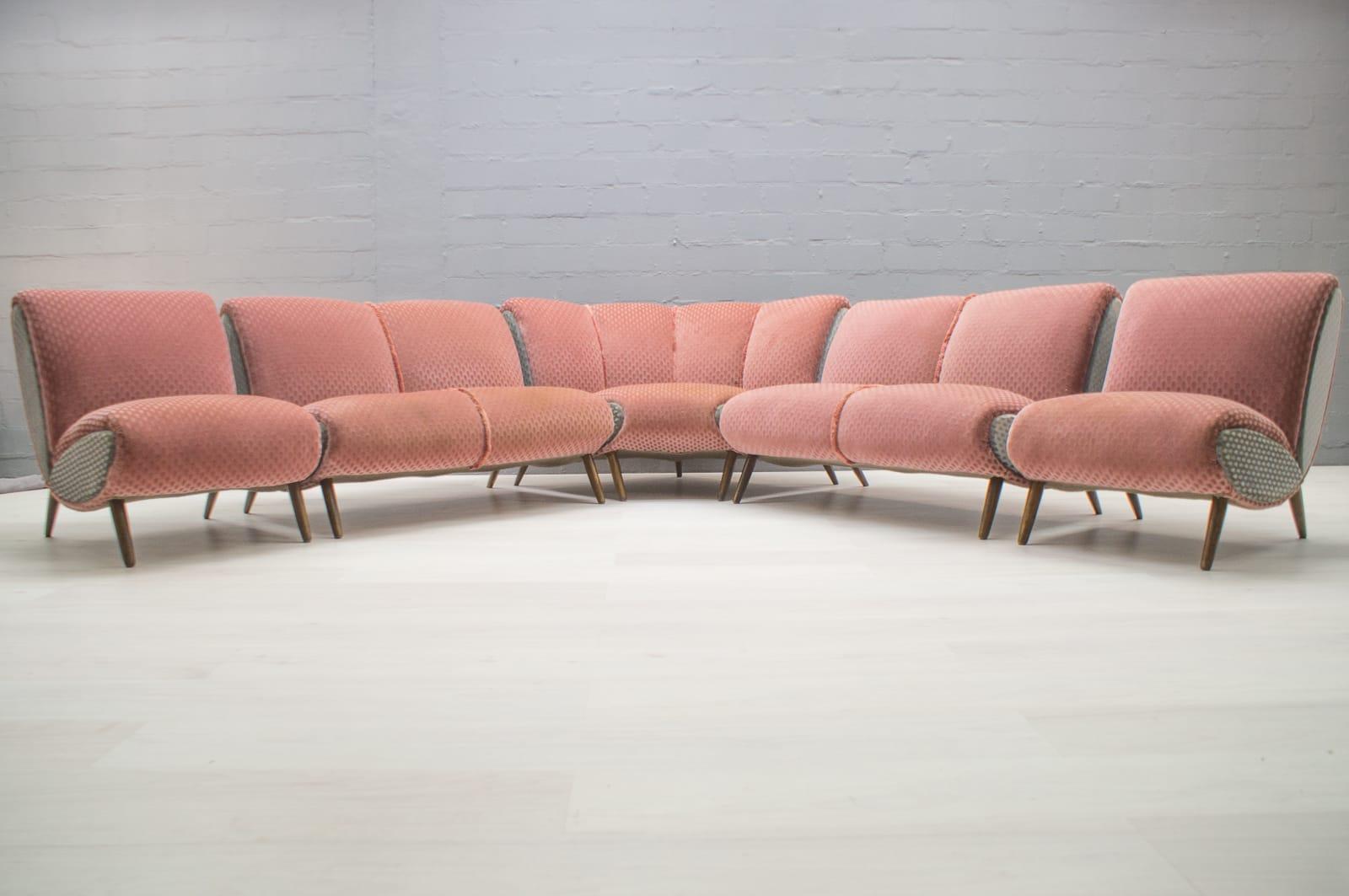 Extremely rare huge sofa set by Norman Bel Geddes from the 1950s. 
We have the set from the possession of a US soldier stationed in Germany or Roth after the 2nd World War. 

In the variant with two two-seat sofas, two single armchairs and the