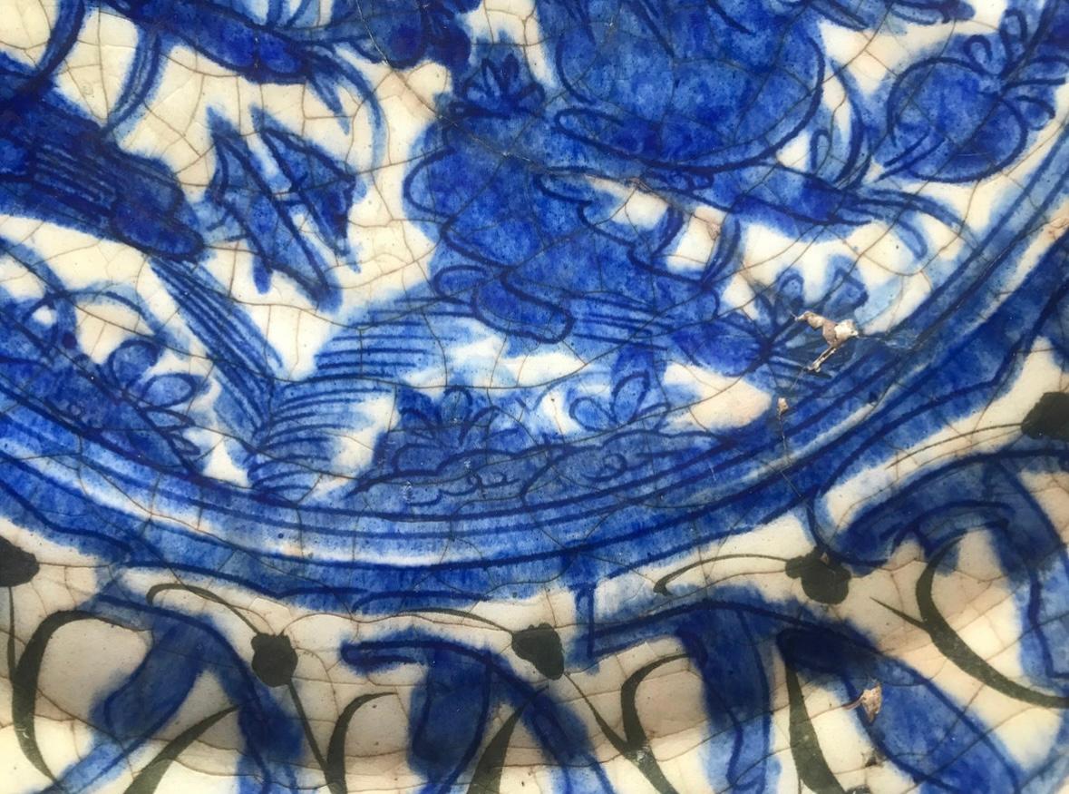 Extremely Rare Islamic Safavid Blue and White Large Dish Persian 16th Century.

This Safavid fritware dish is painted under the glaze in black and cobalt blue. The rim is decorated with blue and black ribbons and with two birds in the reserve. This