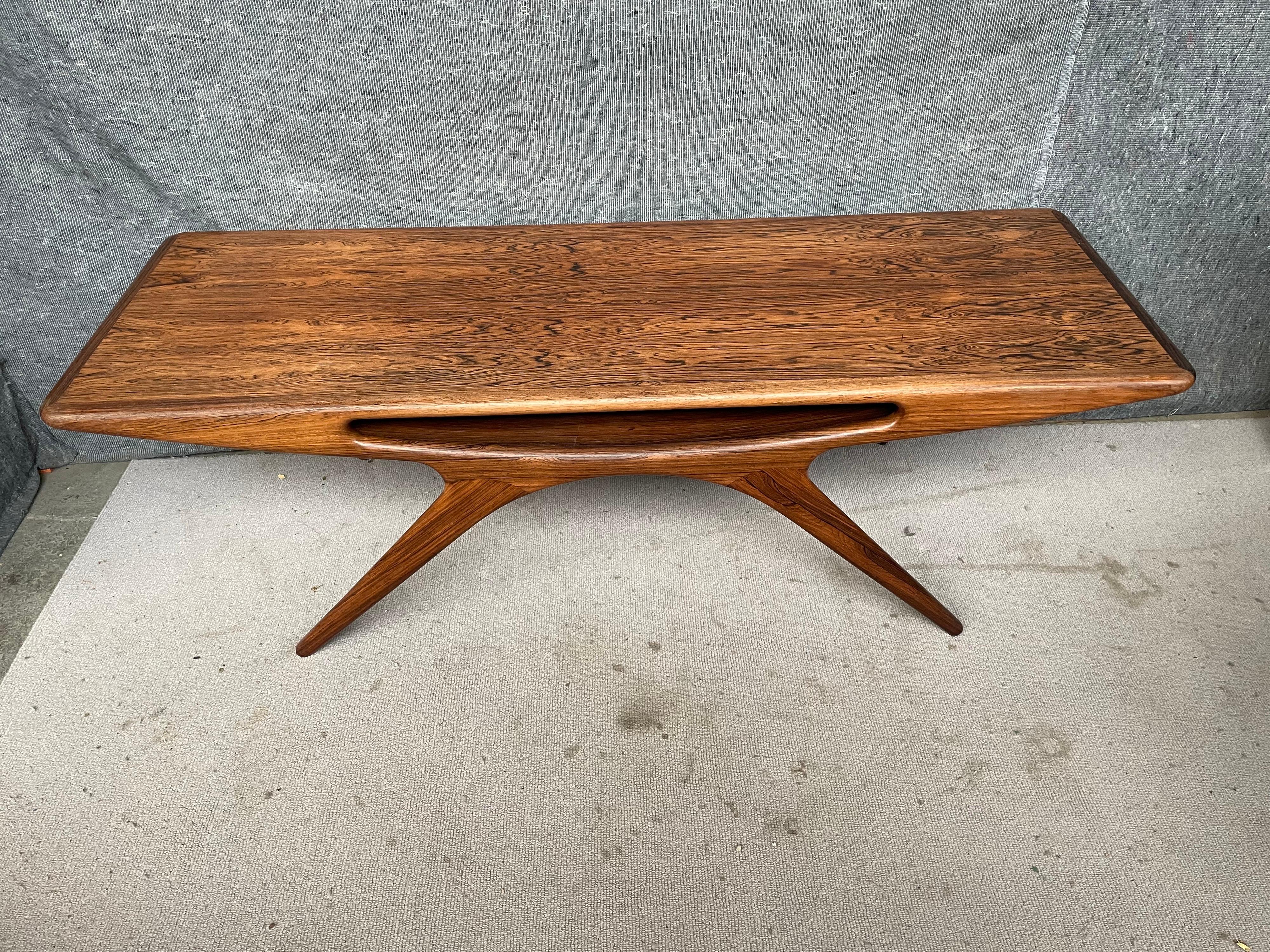 1960´s Smile table, Smilebordet, UFO table or Smiling table designed by Johannes Andersen. Produced by CFC Silkeborg in Denmark. A triumph of Johannes Andersen design, rarely seen in rosewood - definitely a collectors item. The design succeeds as