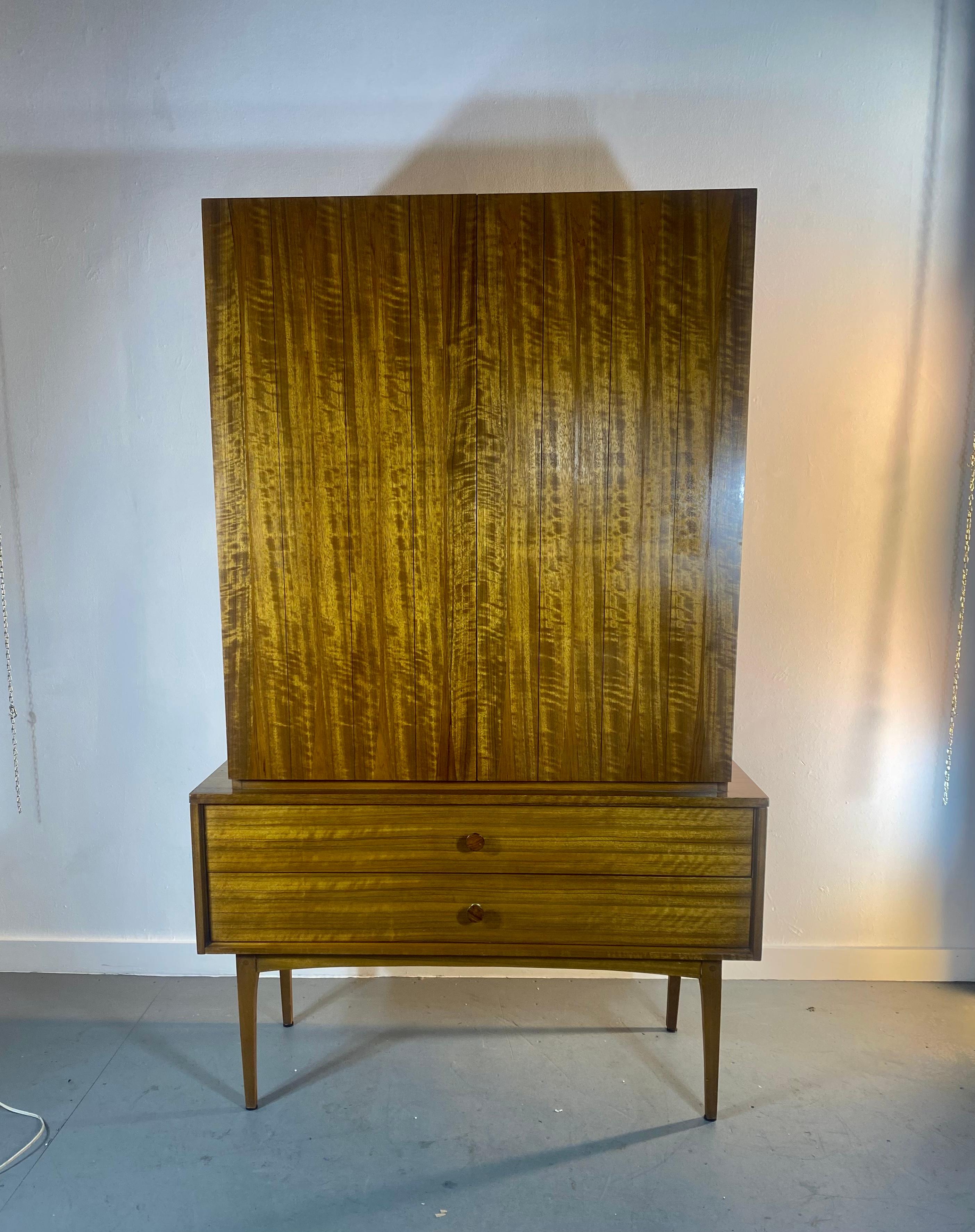 Extremely rare Lane Altavista, Gentleman's Chest / Armoire, flamed ribbon mahogany, rosewood and brass hand-pulls. Maple or birch interior, Classic modernist design. Truly stunning in person, two generous Size drawers / bottom. Two doors a-top three