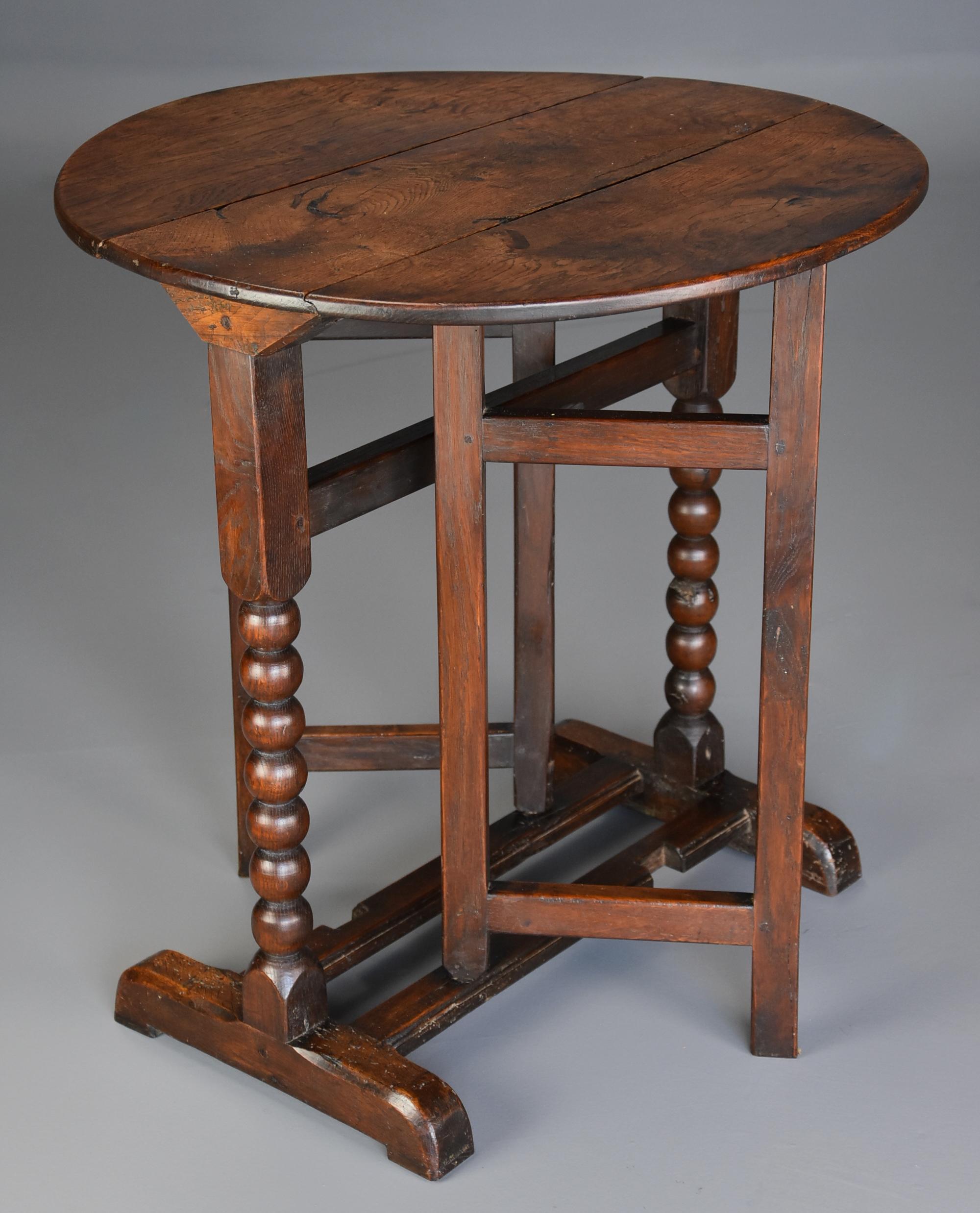 An extremely rare late 17th century (circa 1680) oak joined gateleg table of small proportions with superb patina (color) from the William & Mary period.

This table consists of a solid oak top of excellent patina leading down to an oak base with
