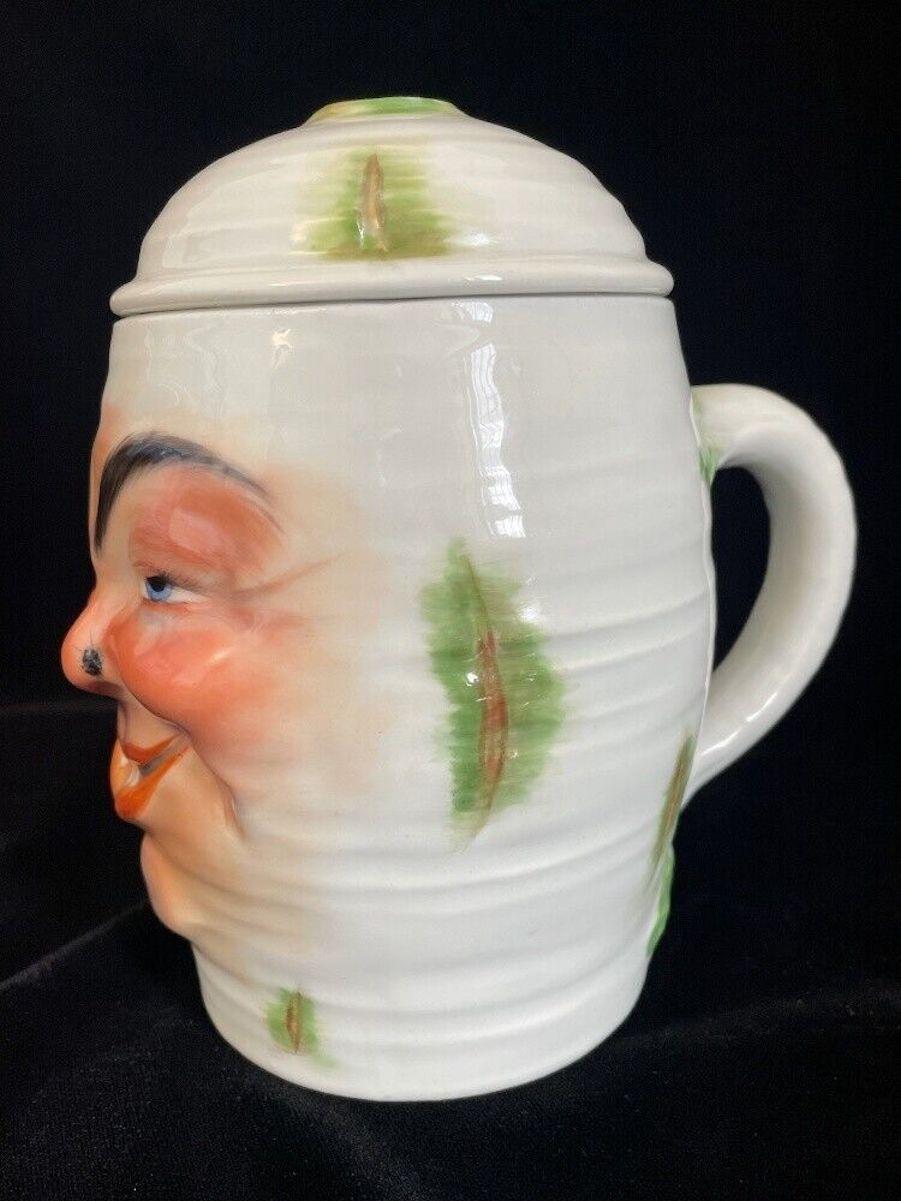 Huge beer mug in the shape of a smiling radish who has had a bit too much beer.
Very intense colours and the whole mug designed with the surface of a radish.
A bit strange to look at, but very funny though. Nevertheless a very rare piece.

The