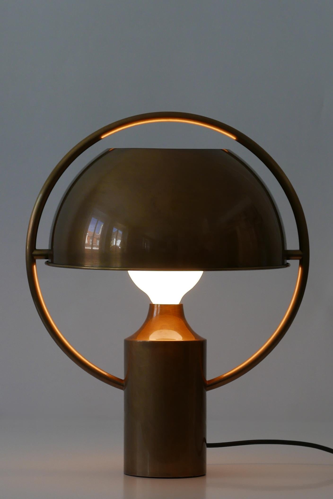 Exceptional, large and elegant Mid-Century Modern brass table lamp with rotating lamp shade. Designed by Günter Schulz for Florian Schulz, 1970s, Germany. An employee of Florian Schulz confirmed that this piece was designed by Günter Schulz, father