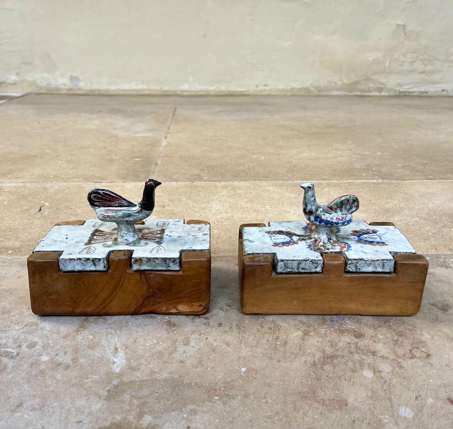 Two rare boxes  by Jean Derval.
Glazed ceramic lids with bird shaped handle, olive wood box.
Small variations in decoration and bird's shapes and sizes 
