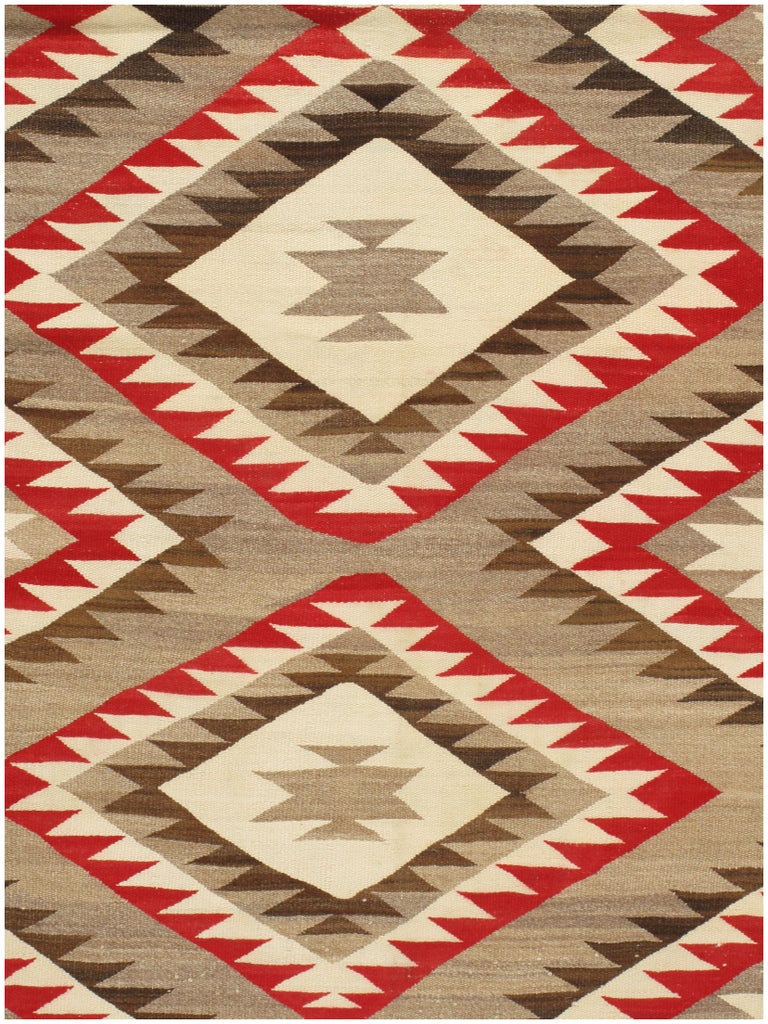 A rare large size Navajo rug, circa 1930s. Size: 8'3 x 15'5. Antique Navajos are usually in scatter sizes and larger, room size pieces are both extremely rare and highly desirable. As perpetually fashionable as they are collectible, traditional