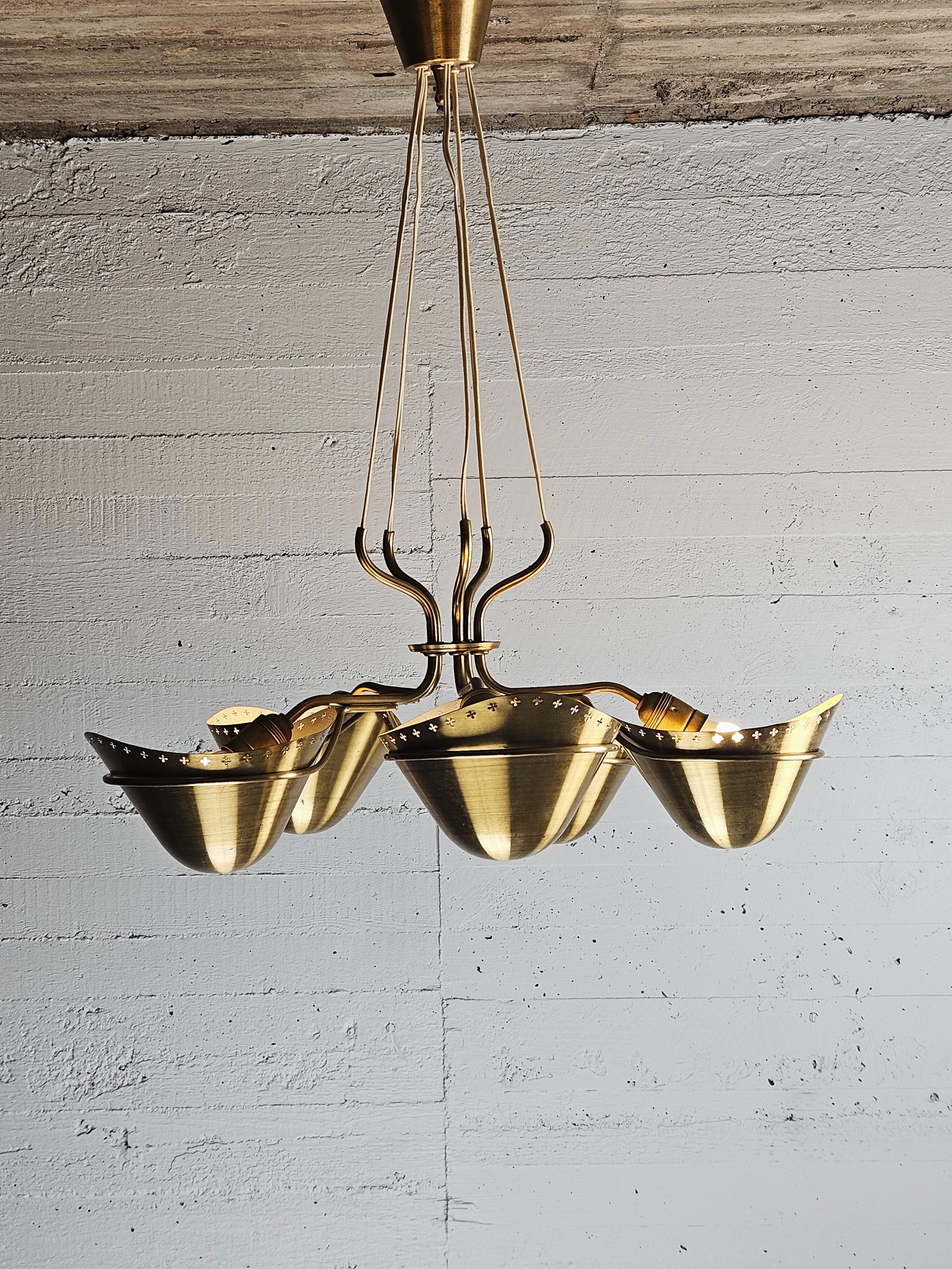 Swedish modern brass ceiling lamp. The design very well embrase the Scandinavian modern style and designers like Carl-Axel Acking or Hans Bergström comes to mind. The designer though for this model is unknown. 

Made in brass and gives a beautiful
