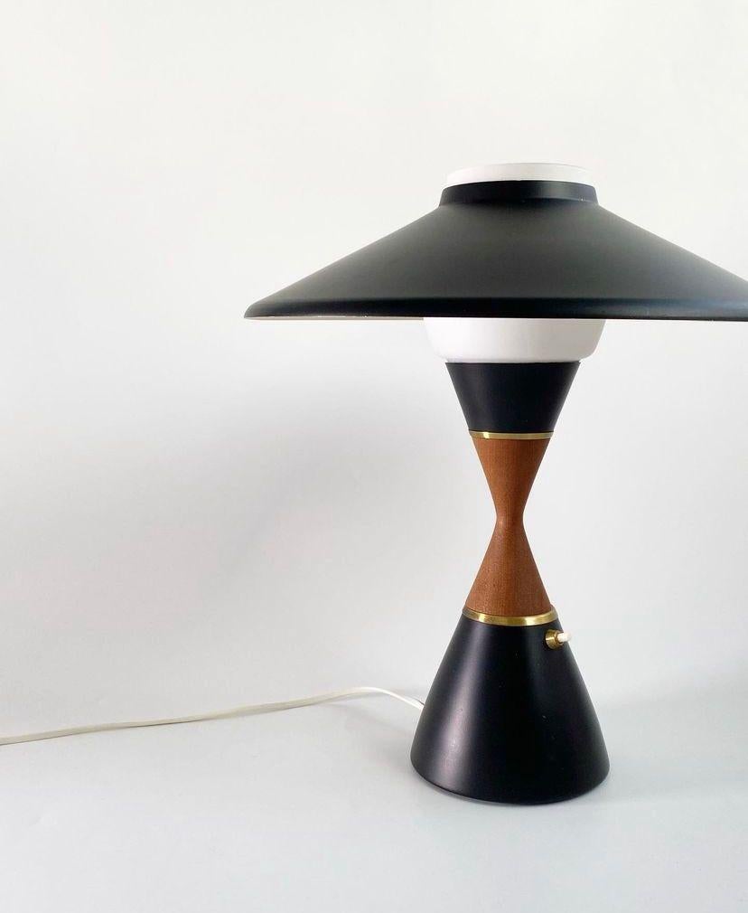 Extremely rare modernist Table Lamp designed by Svend Aage Holm Sørensen, Denmark, 1950s.
Made of Teakwood, milky glass, black lacquered metal and beautiful brass details.

Danish designer Svend Aage Holm Sørensen (1913-2004) is known for his
