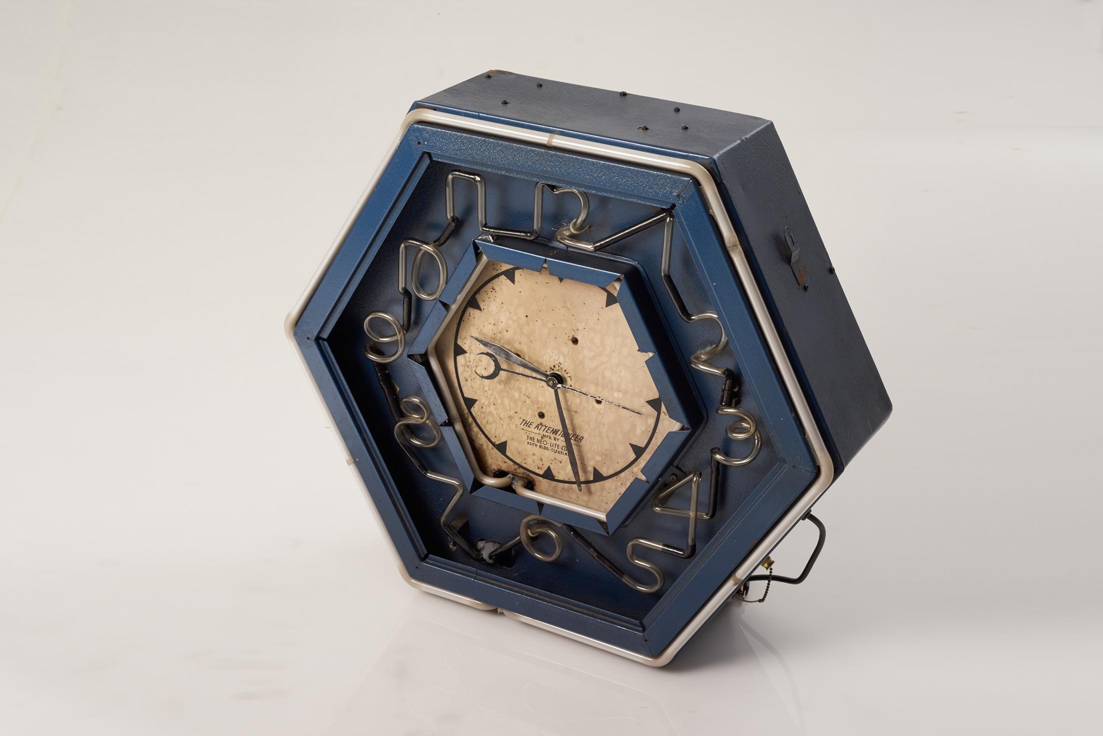 The Attentioneer

 The Neo-Lite Corp

 Rare Authentic circa 1930s 

The clock is in perfect working condition– displaying beautiful neon numerals and a neon bordered face and case. It has not been restored–only diligently put in good working