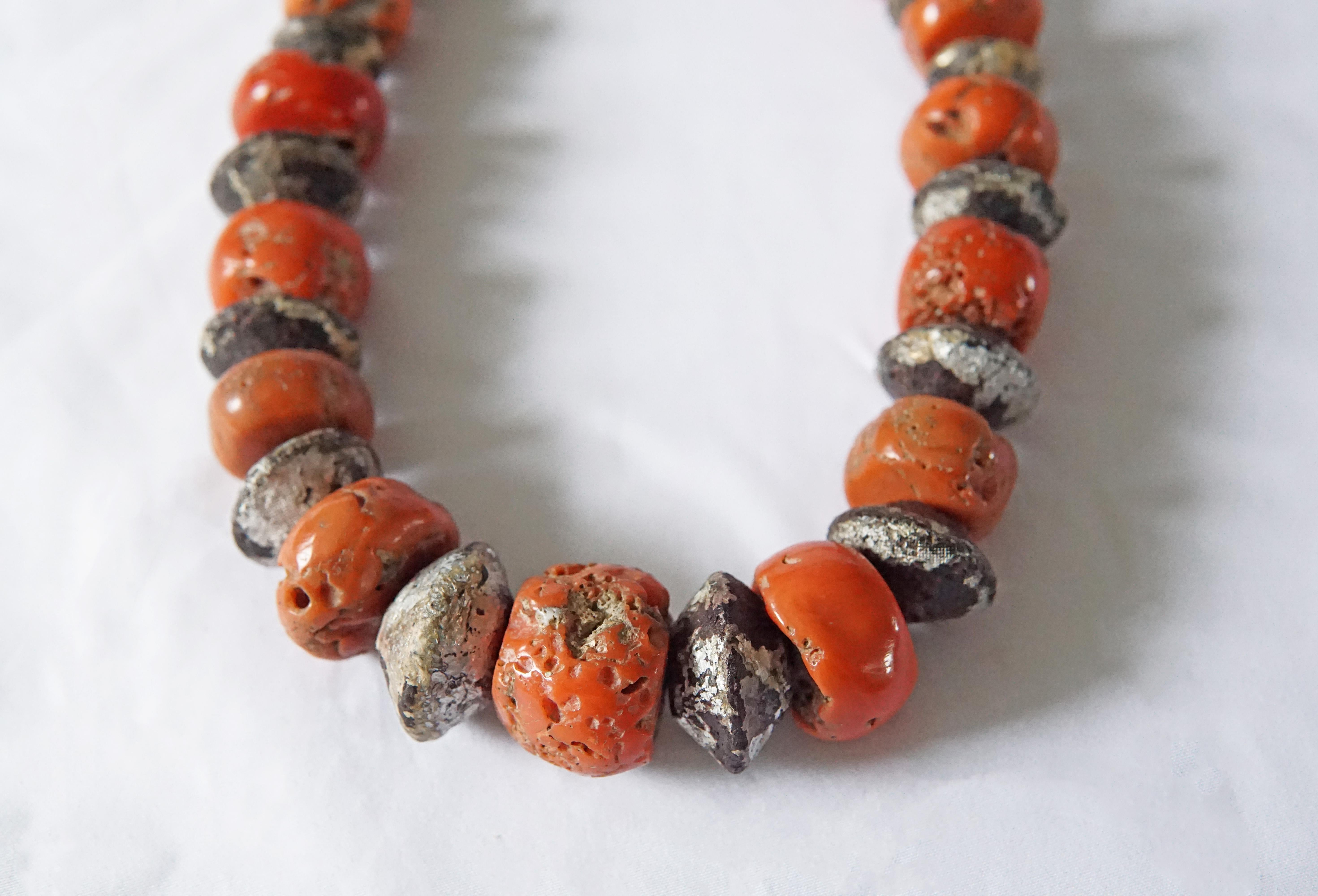 A wonderful example of a Tibetan Coral Bead mala / neckpiece with a stunning mix of orange & red colours that have aged beautifully over the decades. Tibetans believe that coral holds great power for the wearer both spiritually as well as
