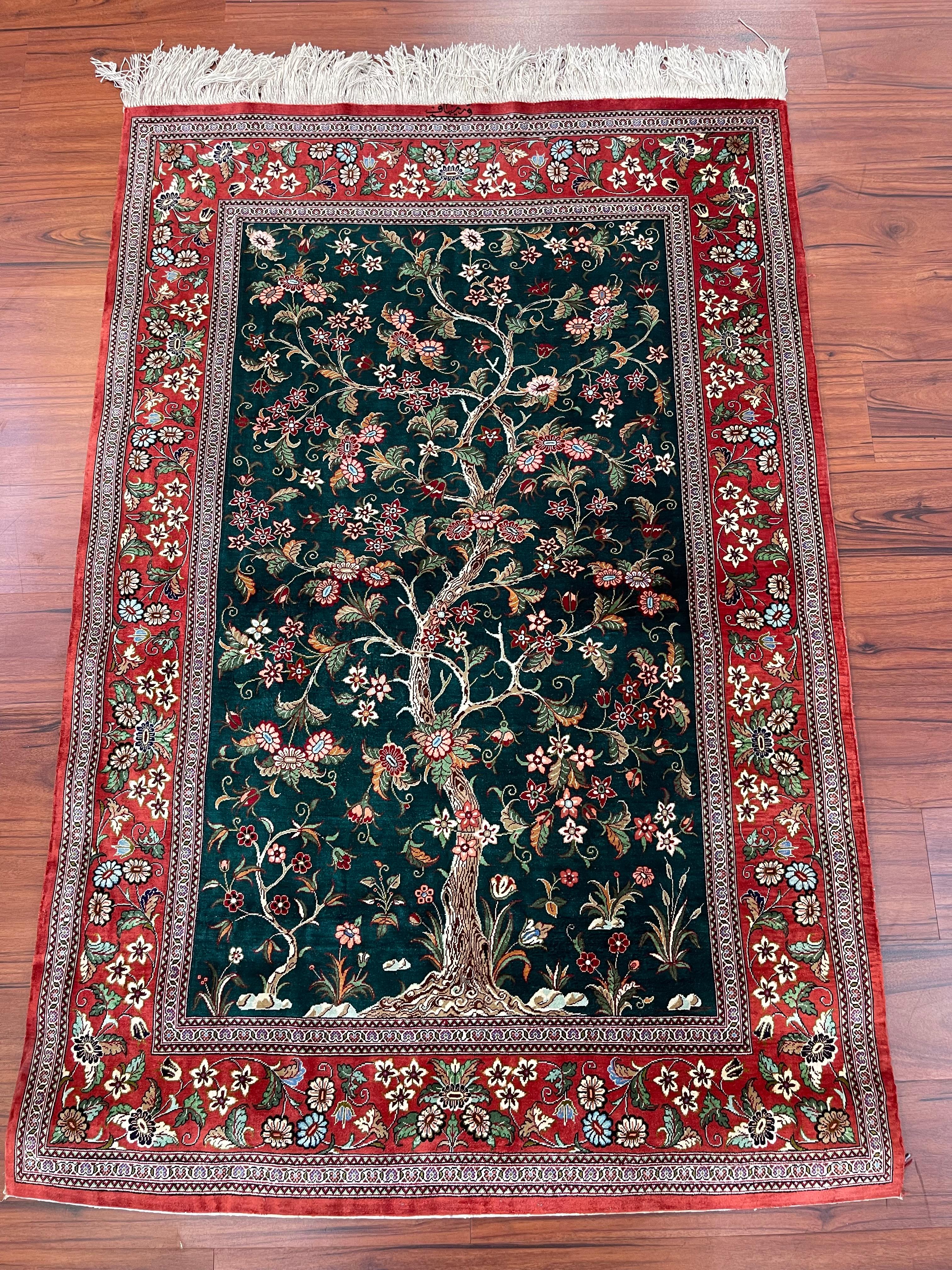 A stunning Extremely Fine Persian Silk Qum Tree of Life Rug. This beautiful 100% Silk rug is in excellent condition and originates from Iran in the late 20th century. 