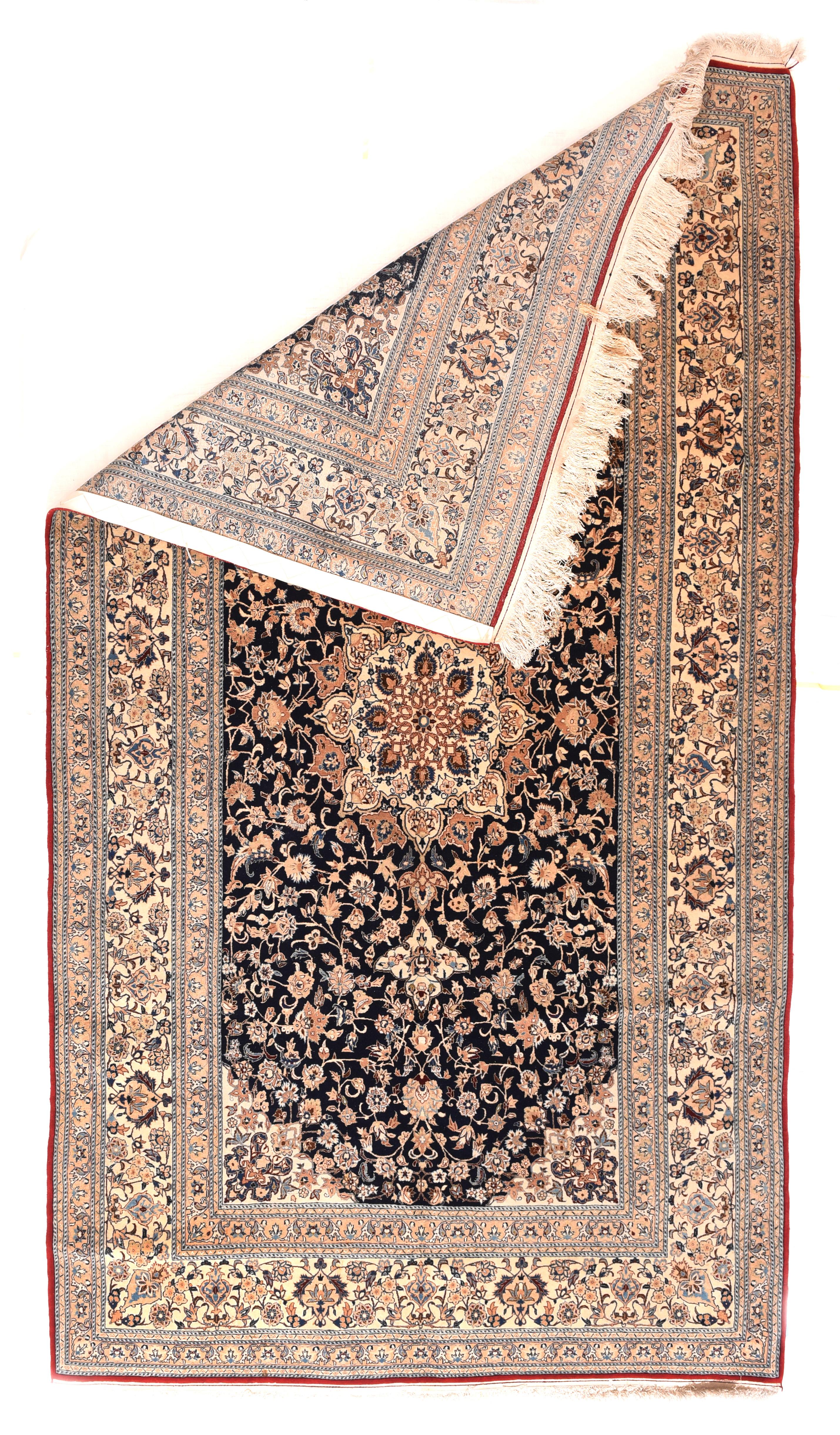 Nain rugs are constructed using the Persian knot and typically have between 300 and 700 knots per square inch. The pile is usually very high quality wool, clipped short, and silk is often used as highlighting for detail in the design.

Close to the