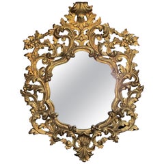 Exuberant Italian Revival Carved Giltwood Mirror