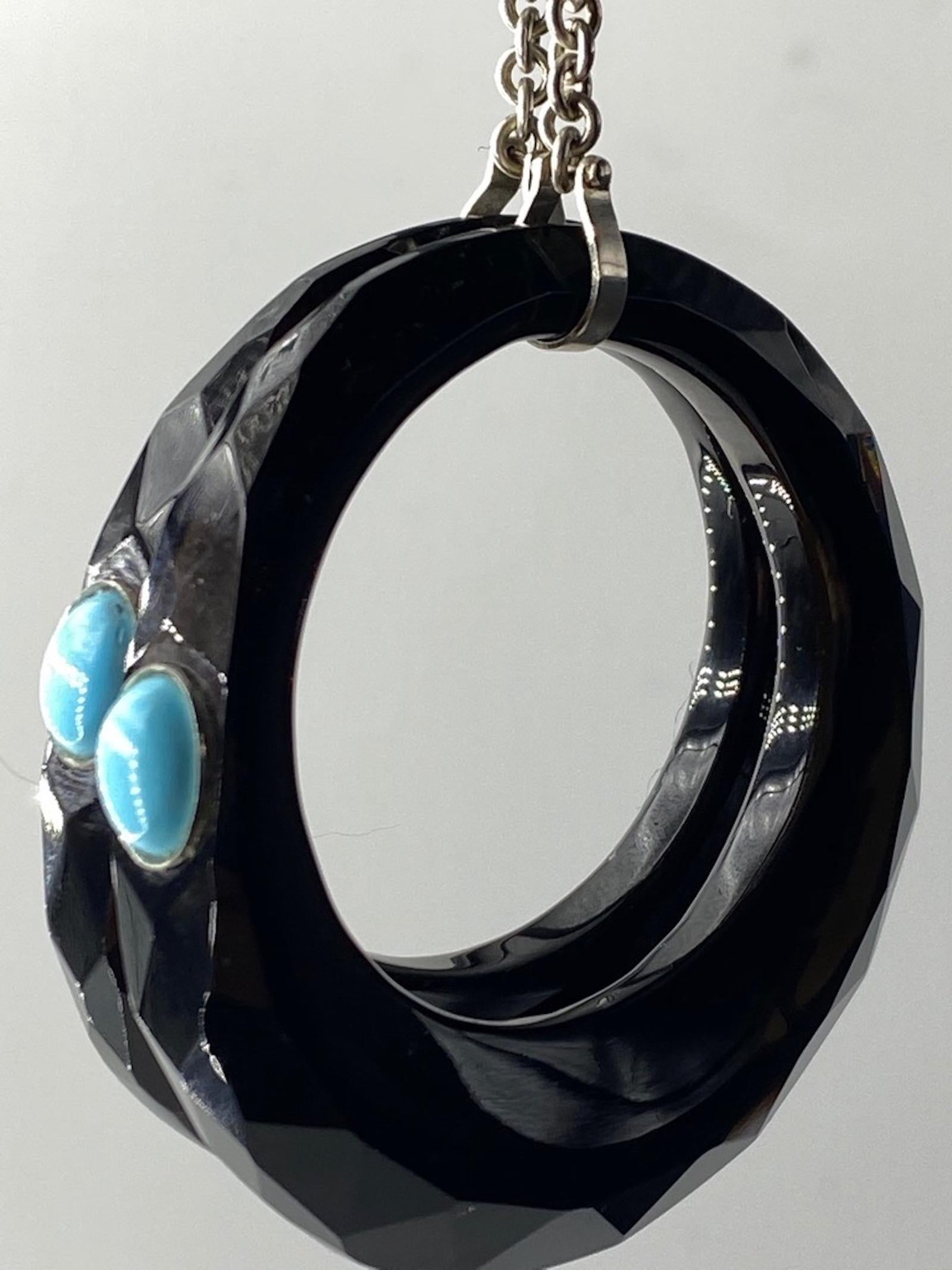 Eye catching Black Onyx earrings with Turquoise designed by Merideth McGregor of 
April in Paris Designs. Black onyx is one of the most intriguing stones you’ll ever come across. For thousands of years onyx has been used as a source of protection