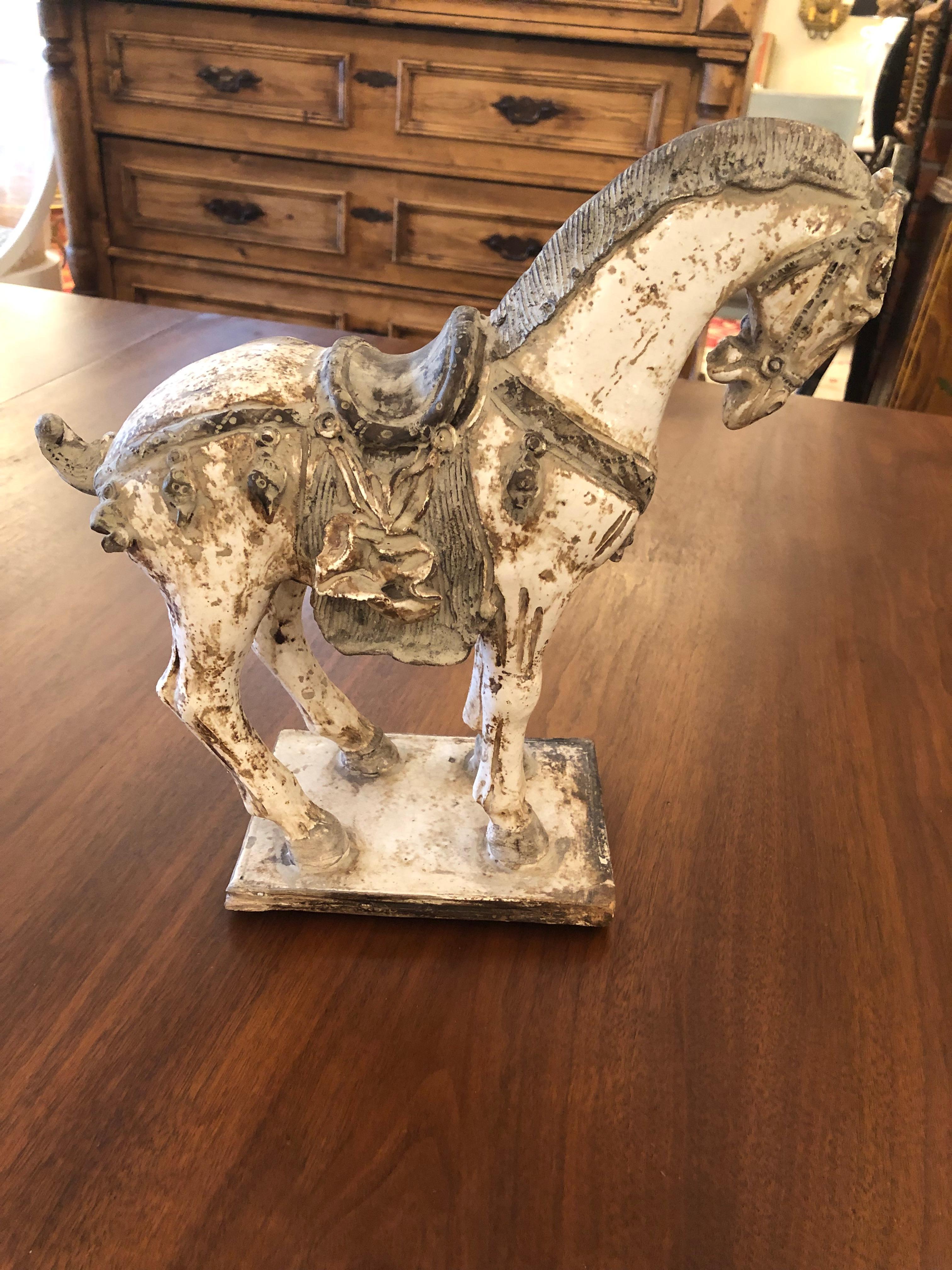 Beautiful Tang Dynasty style ceramic horse sculpture with great detail in cream, brown and black.

Gail.