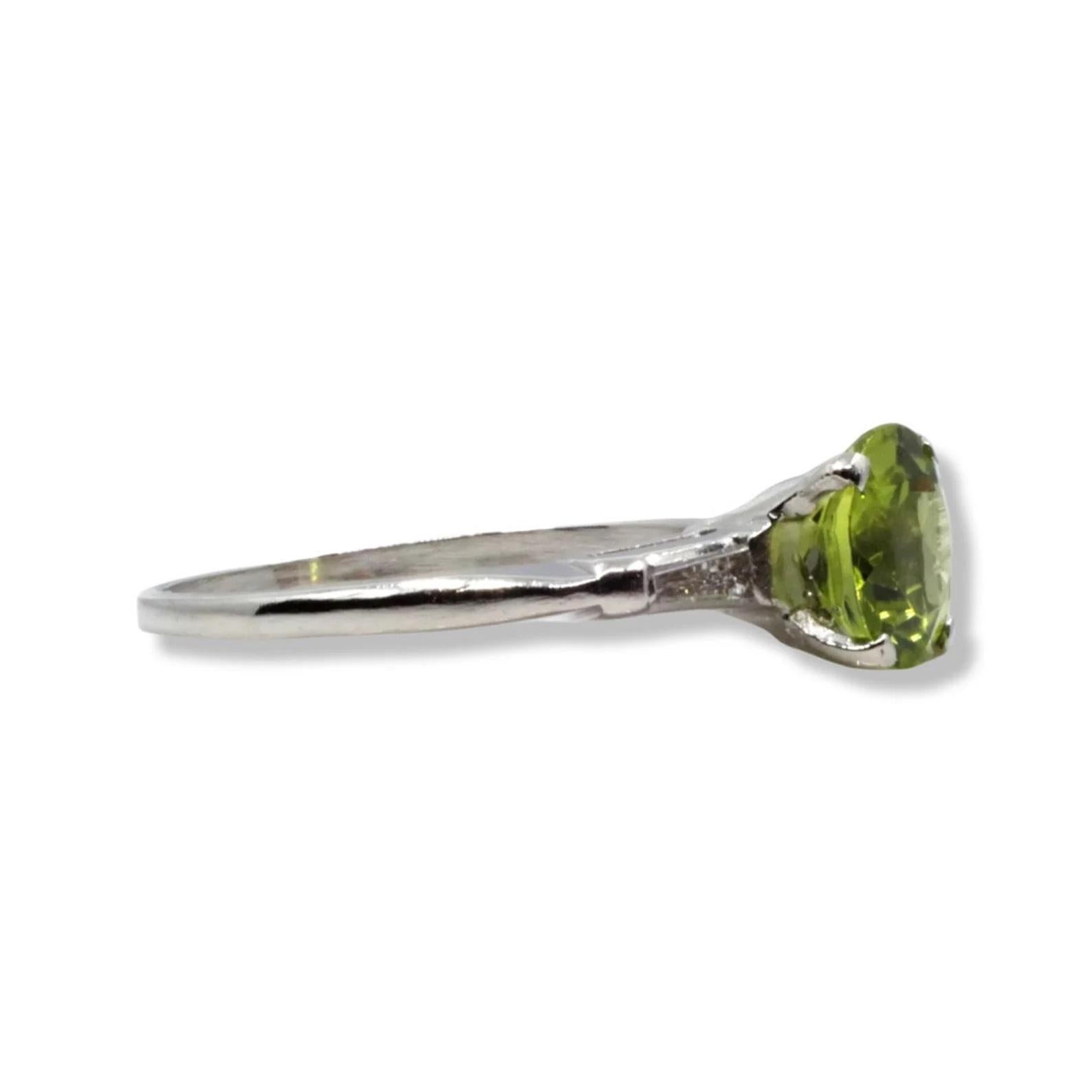 Round Cut Eye Catching Peridot & Baguette Diamond Three Stone Ring in Platinum For Sale