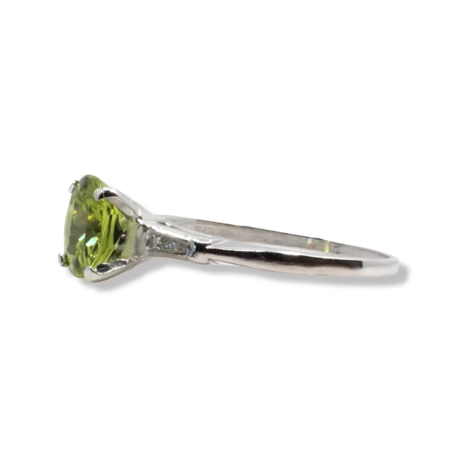 Eye Catching Peridot & Baguette Diamond Three Stone Ring in Platinum In Good Condition For Sale In Boston, MA