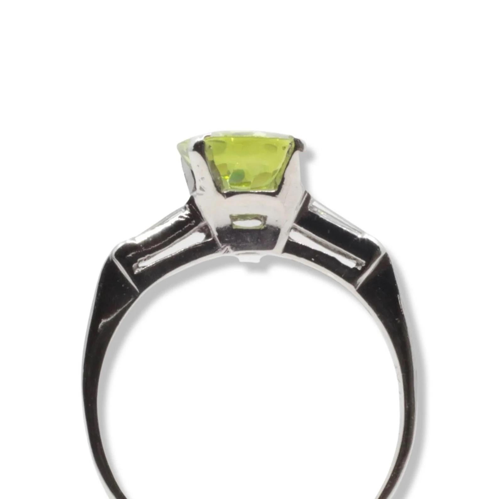 Women's Eye Catching Peridot & Baguette Diamond Three Stone Ring in Platinum For Sale