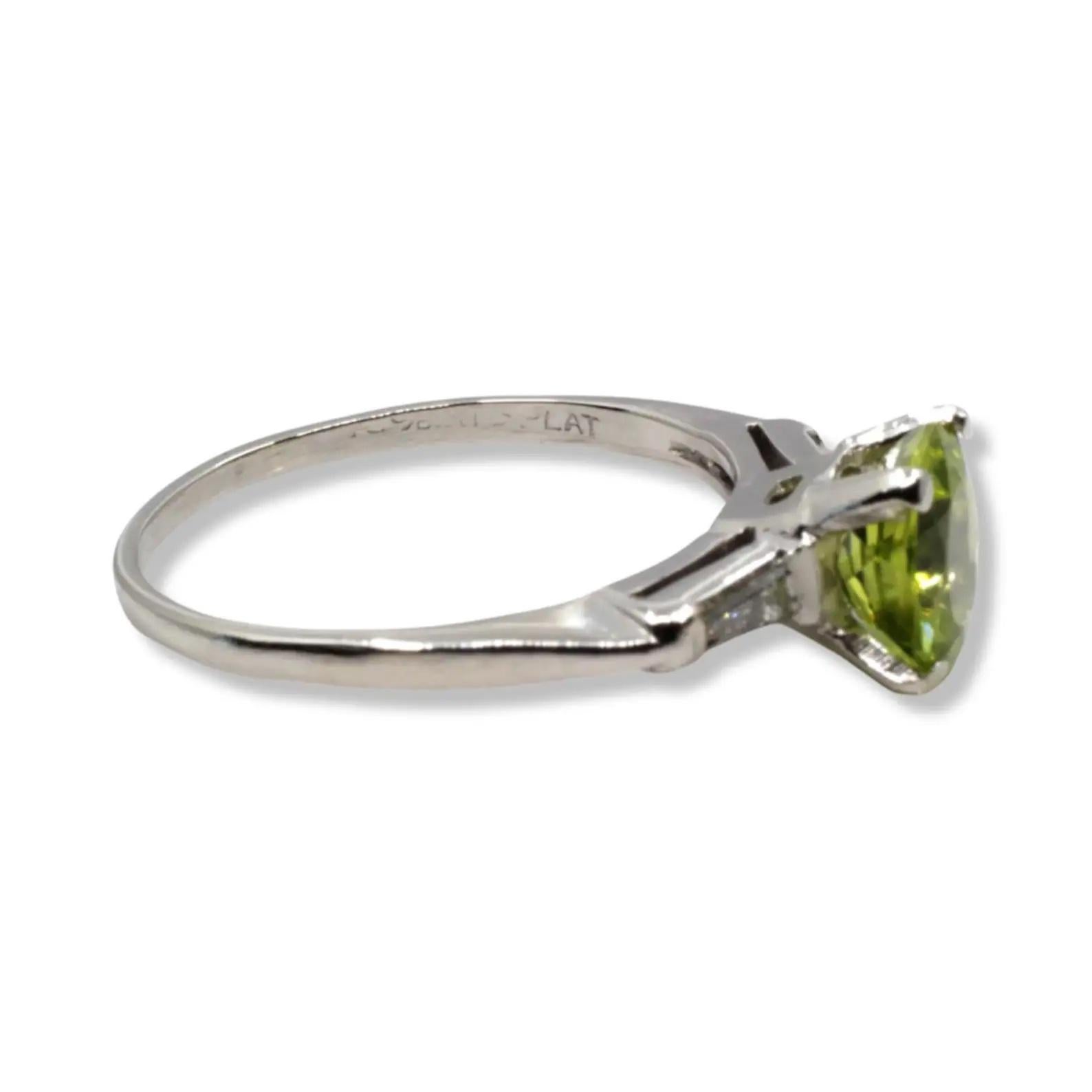 Eye Catching Peridot & Baguette Diamond Three Stone Ring in Platinum For Sale 1
