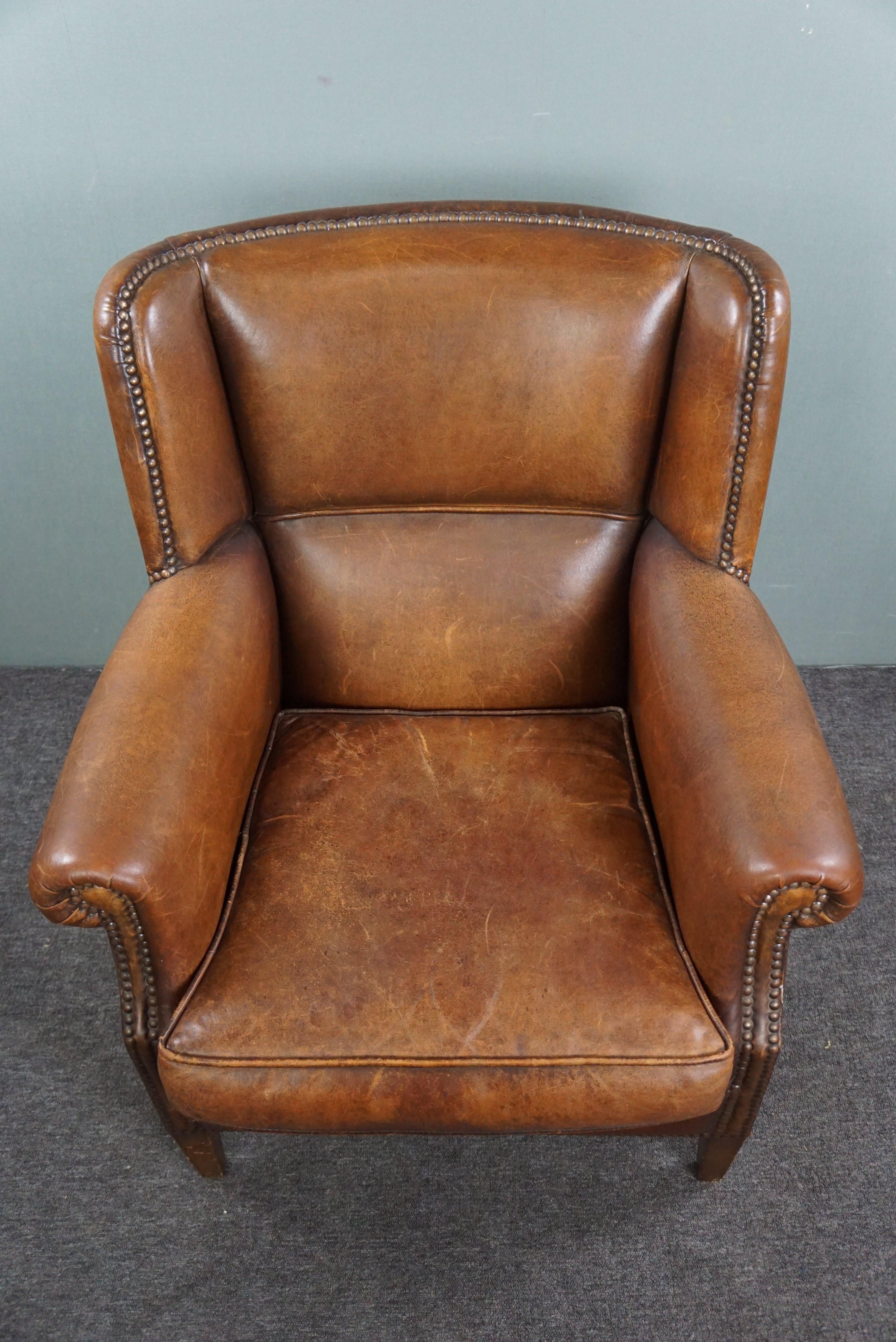 Eye-catching weathered sheep leather wingchair For Sale 2