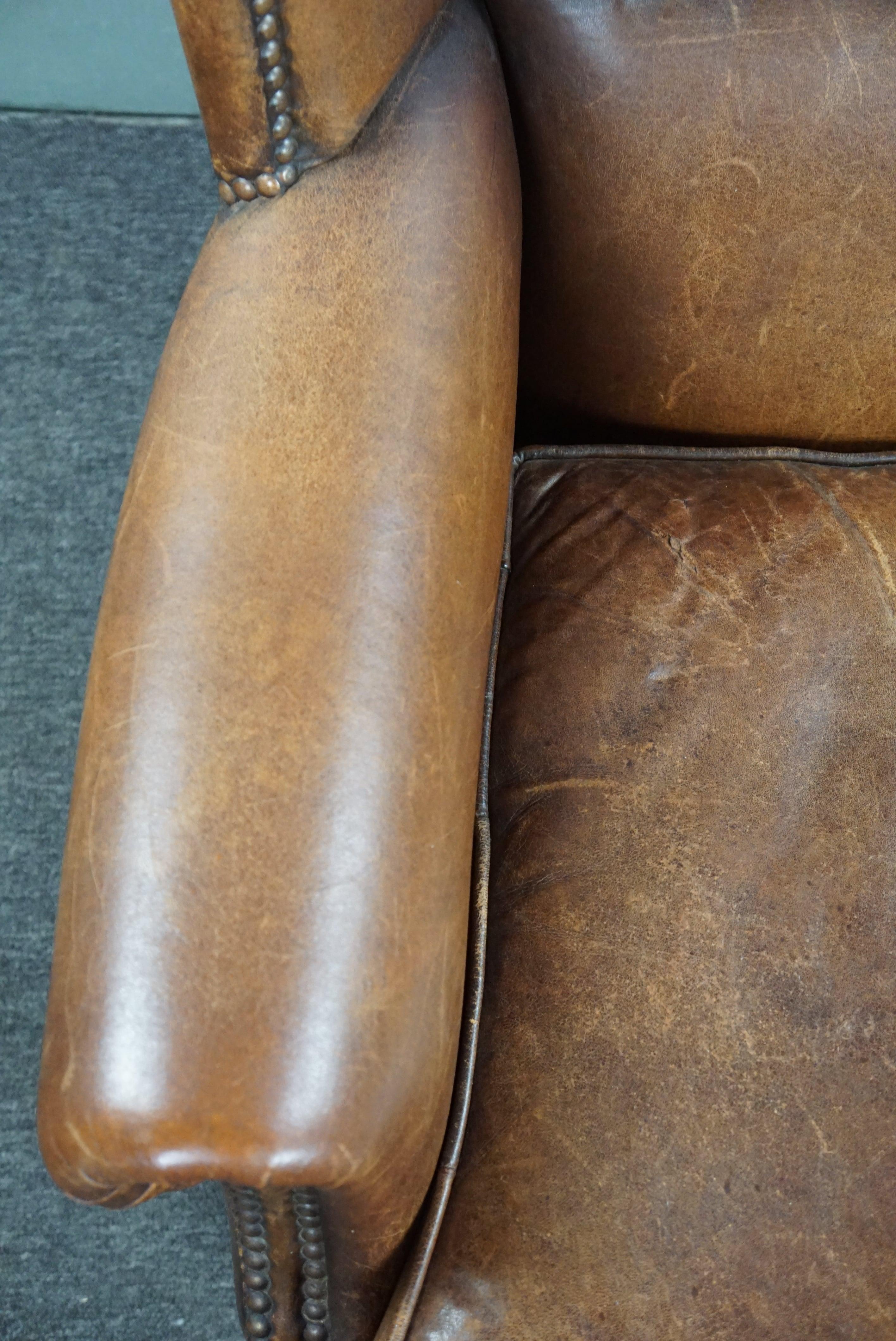 Eye-catching weathered sheep leather wingchair For Sale 3