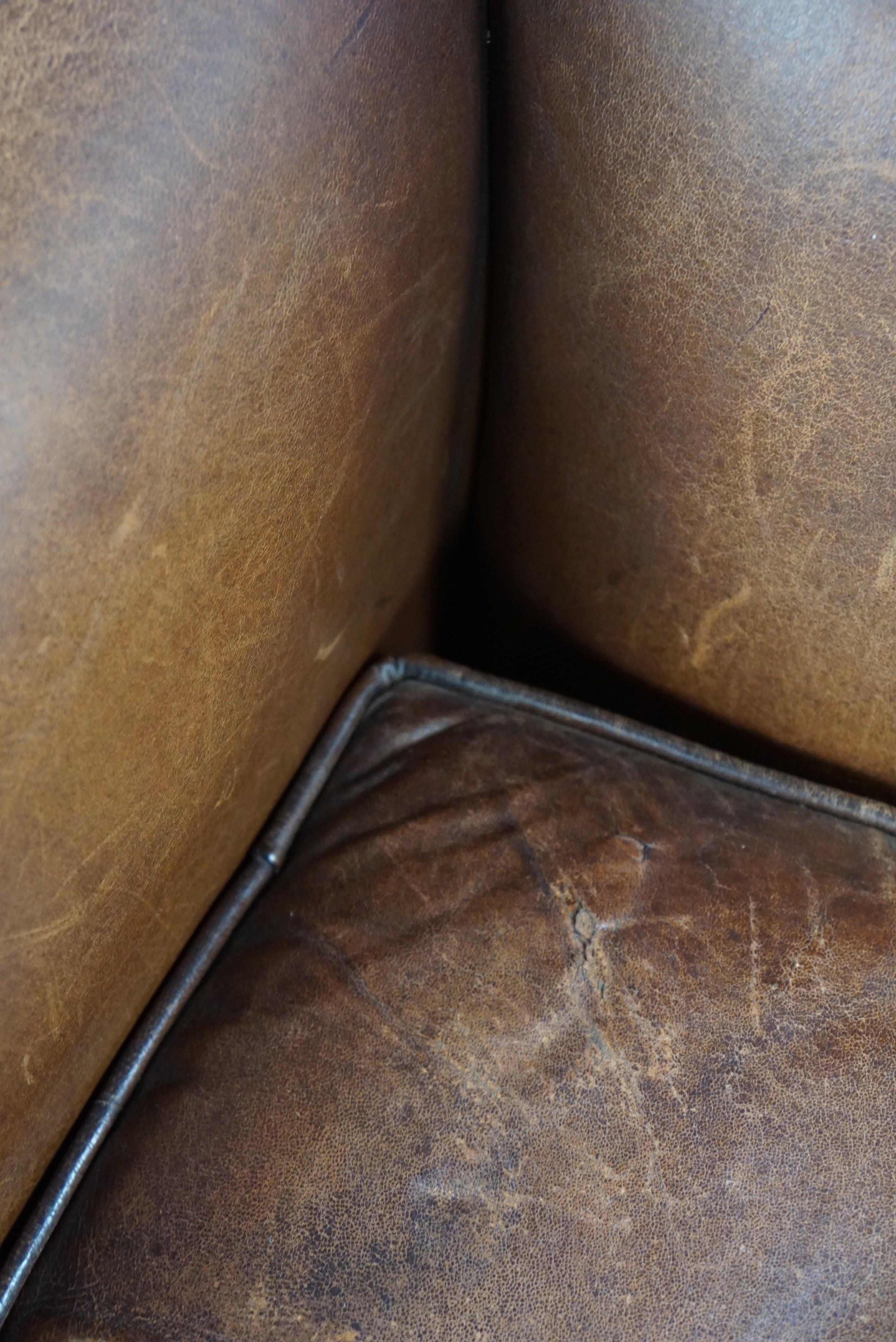 Eye-catching weathered sheep leather wingchair For Sale 4