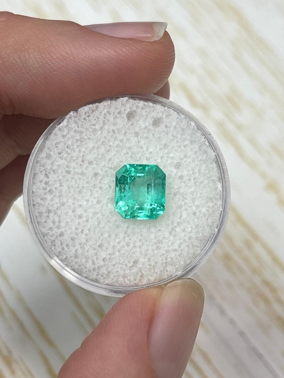 Stone: Emerald
Weight: 2.03-carats
Shape: Emerald Cut
Clarity: Transparent
Luster: Very Good
Color: Medium Bluish Green
Measurements: 7.90mm x 7.16mm x 5.35mm
Geographic Origin: Colombia
Treatment: Natural, Oiling

Comments: Due to their growth