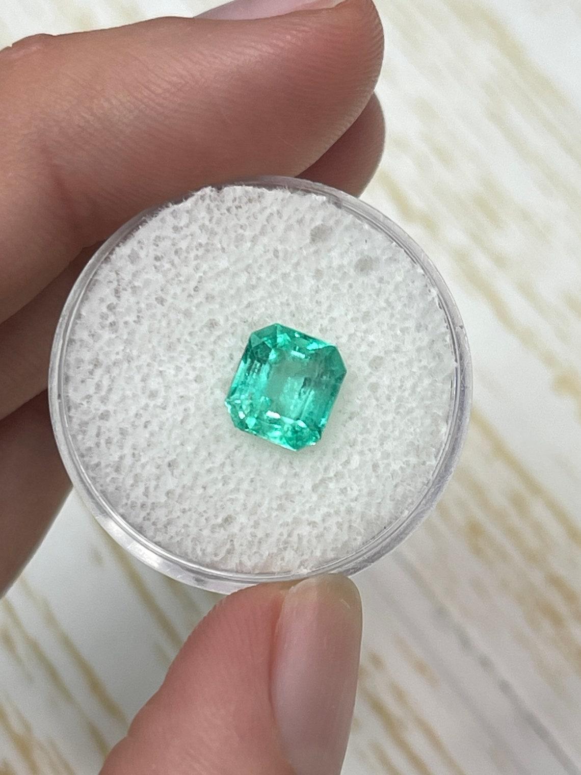 Modern Eye Clean 2.03 Carat Bluish Green Emerald Cut Colombian Emerald Gem - May For Sale