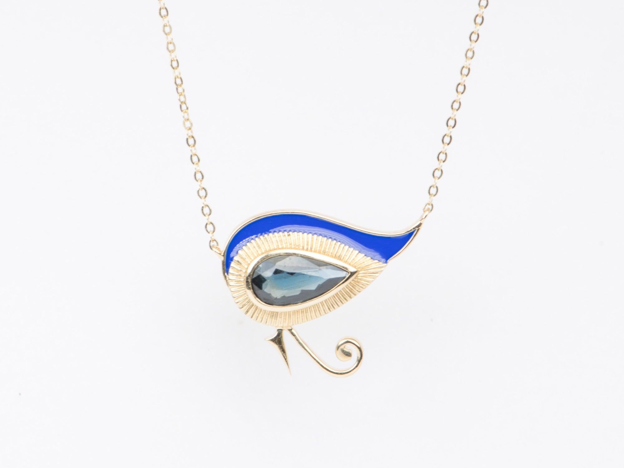 ♥ Eye of Horus Pear Shaped Sapphire 14K Yellow Gold Necklace with bright blue enamel
♥ The item measures 19.2mm in length, 23mm in width, and stands 3.5mm from the finger

♥ Gemstone: Sapphire, 1.82ct
♥ All stone(s) used are genuine, earth-mined,
