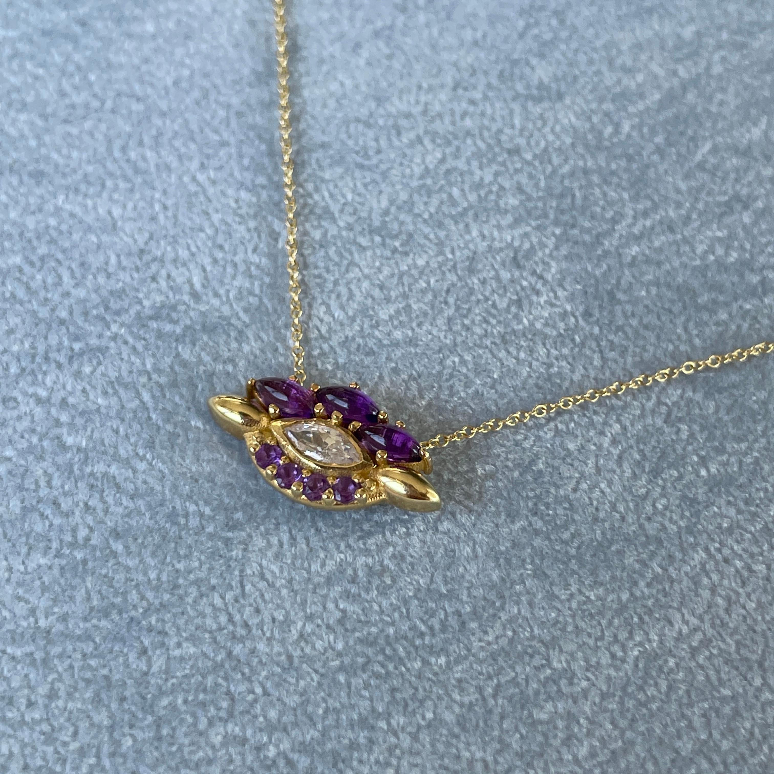 Contemporary Eye Pendant in 18 Karat Yellow Gold With A Pear Shaped Diamond And Amethysts For Sale