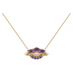 Eye Pendant in 18 Karat Yellow Gold With A Pear Shaped Diamond And Amethysts