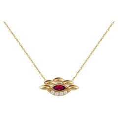 Pendentif oeil en or jaune 18 carats avec diamants et rubis