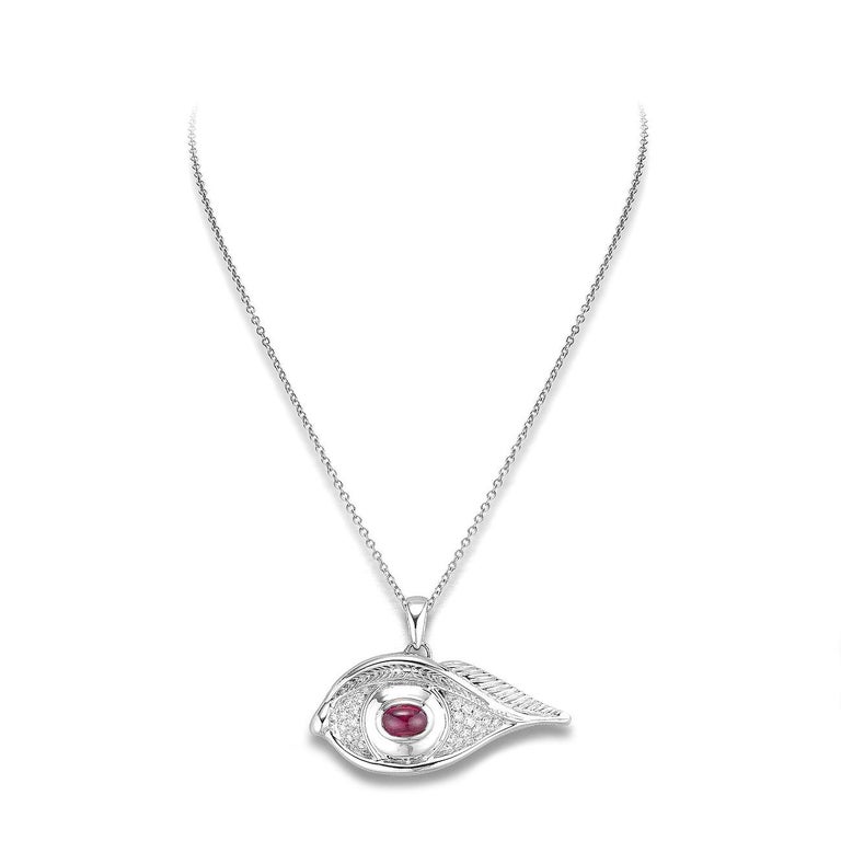 Eye pendant in 18kt white gold set with one cabochon cut ruby 1.00 cts and 20 diamonds 0.32 cts       