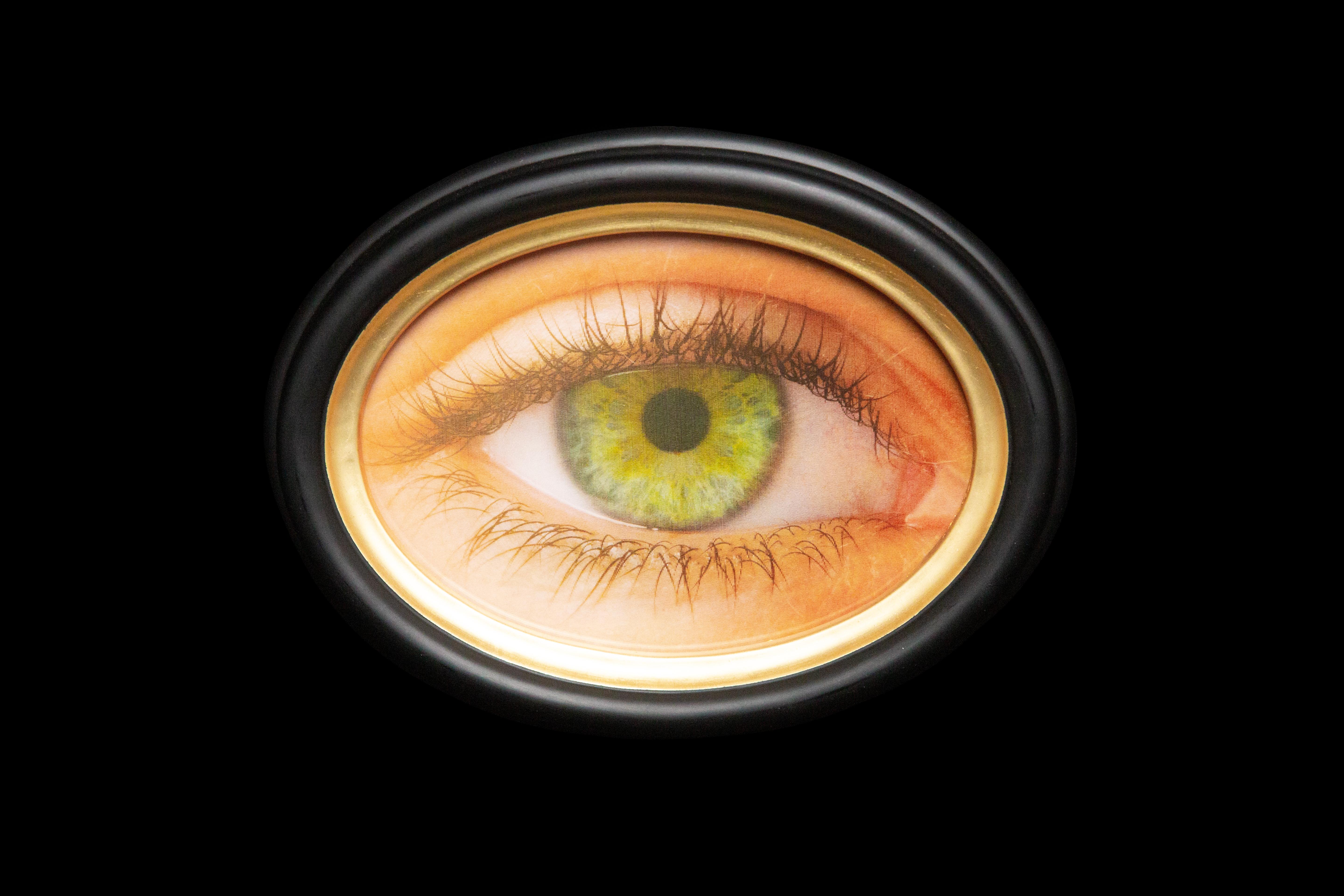 Transform any space with this one-of-a-kind Black and Gold Wood Framed Oval Lenticular Eye—a mesmerizing art piece that blinks as you move! Measuring 6 inches by 9 inches, the beautifully crafted wooden frame boasts a sleek black finish highlighted