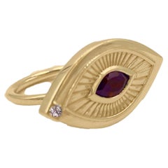 Anillo simbolista de oro amarillo de 18 quilates con granate y diamantes en forma de ojo de suspiro victoriano