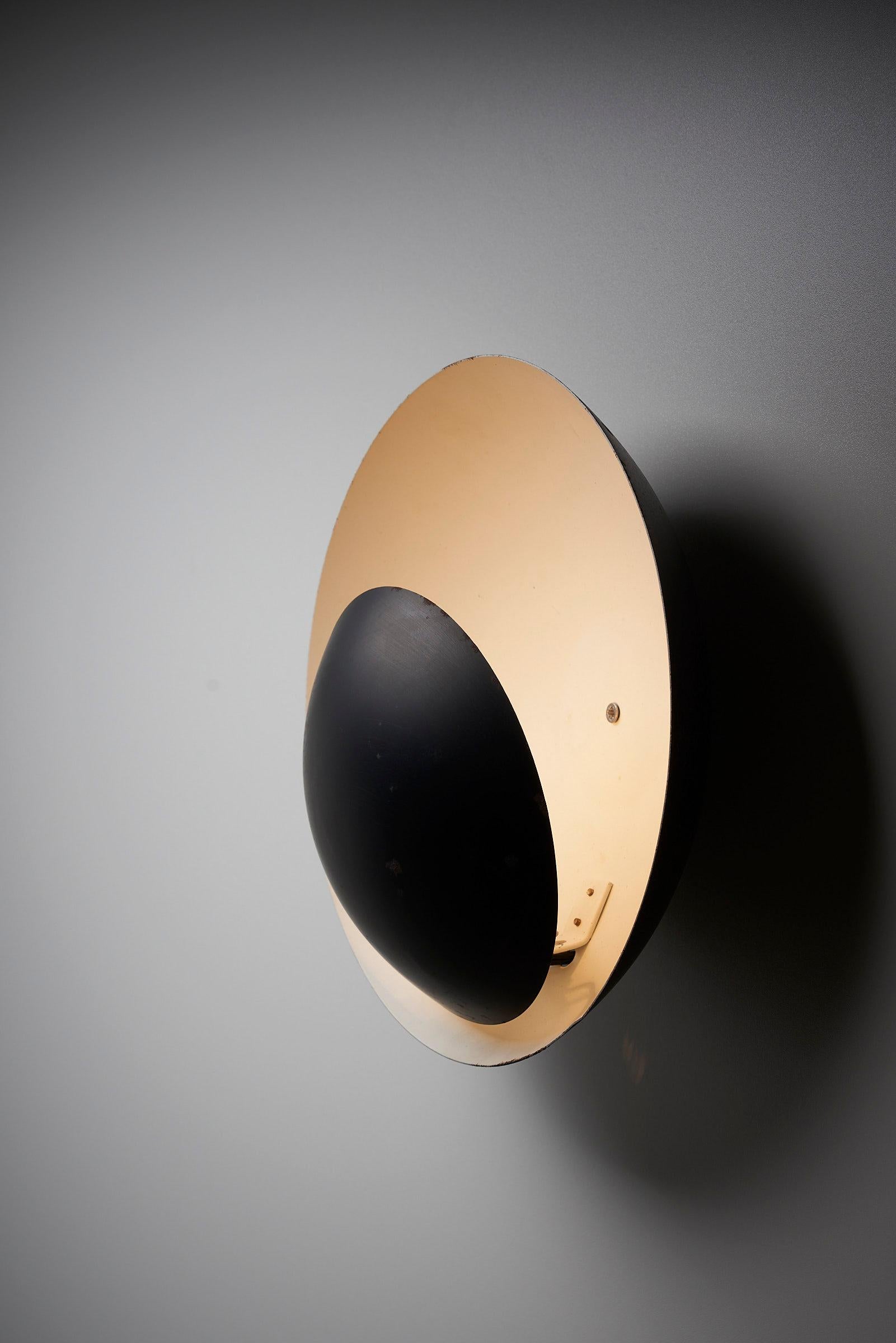 Introduce a visually striking and thoughtfully designed lighting piece to your space with the Wall Lamp by BuR Leuchten. This wall lamp features a captivating composition created by two half-spheres, resulting in a truly stunning aesthetic.

The