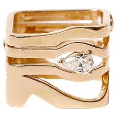 Eye Temple ring (0.40 carat pear cut diamond, 0.30carat two rounds diamonds)
